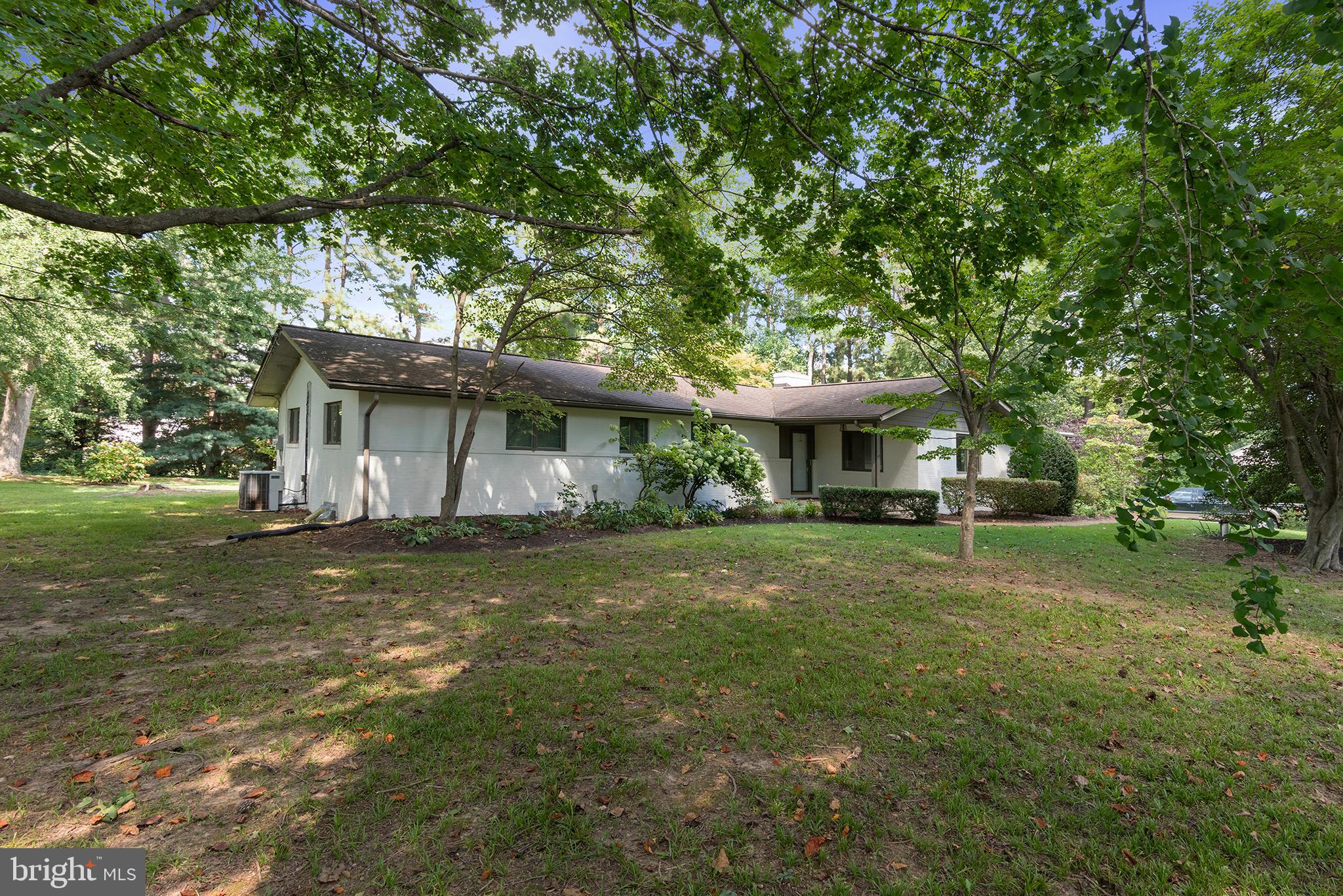 Located in Country Club Estates, on a lovely, corner lot with mature trees. Solid brick rancher with good bones. 3 bedrooms, 2 full baths. The basement has a workshop space and garage. Hardwood floors. Spacious family room with woodstove. Nice screened-in porch and outdoor patio with a fire pit. Home is ready for your finishing touches. Near the Chester River Yacht and Country Club and just a few minutes to historic downtown Chestertown.