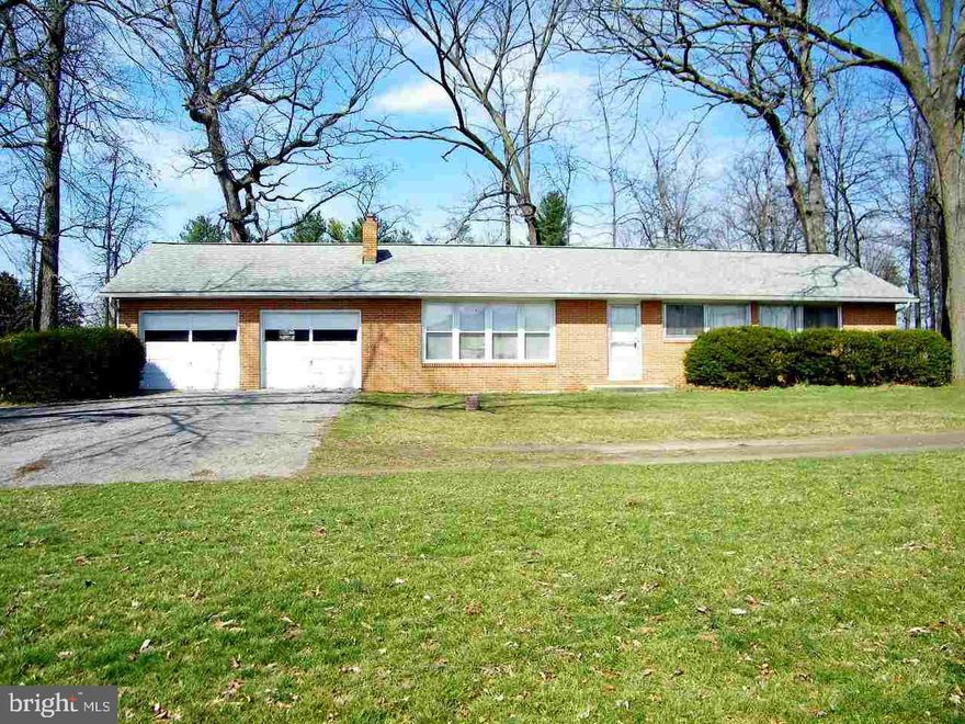 Gaze over a country setting from the front porch.  Do you want great views of the mountain then this is your place.  Live on one floor in this all brick three bedroom two bath ranch.  The two car garage will keep your cars free from the elements.  Wood floors, fireplace, and the room sizes make this a little bit better than most.