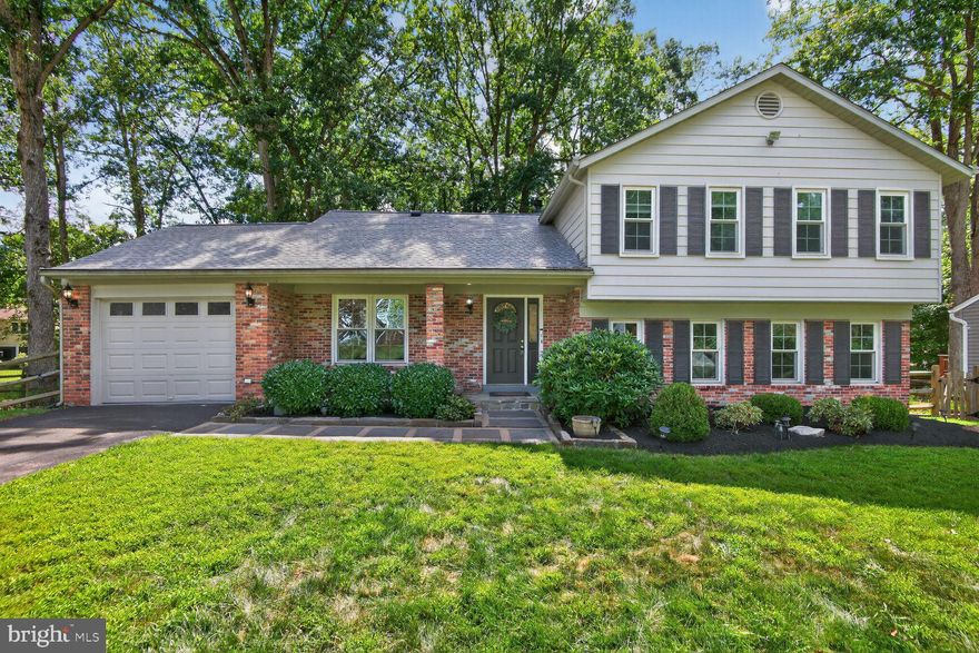 Step inside to discover 4 spacious bedrooms and 2.5 bathrooms, thoughtfully laid out to accommodate both comfort & functionality.   The main level welcomes you with an open foyer leading to a bright living room, formal dining room, & an updated eat-in kitchen. Just off the kitchen, enjoy the convenience of direct access to the one-car garage.   From the living room, step onto your screened-in porch—the perfect spot to relax and take in the beautifully landscaped backyard. A large deck provides an ideal space for outdoor entertaining, & a dedicated shed offers additional storage.     Upstairs, the primary suite features a walk-in closet & private full bathroom. Two additional generously sized bedrooms & a hall bath complete the upper level.    The lower level boasts a warm and inviting family room with a stunning wood-burning fireplace, abundant natural light, a fourth bedroom, half bath, laundry room, & access to the rear fenced yard. A finished basement below offers even more space with a recreation room, utility room, & ample storage. 
Enjoy the benefits of being part of an active civic association, fostering a welcoming sense of community. Just a short distance away are local parks, brand-new trails, & a scenic path to the community center, perfect for outdoor fun and neighborhood events.  Whether you’re seeking peace and privacy, space to explore nature, or an engaged, vibrant community—1519 Foster Rd offers it all.