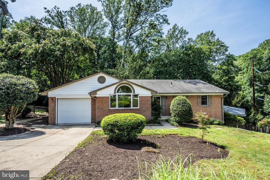 Tucked away within a lush, wooded landscape that transitions to 26-acre parkland; privacy and serenity abounds yet you’re minutes to downtown Vienna, Wolf Trap Park for the Performing Arts and central Tysons. This custom-built rambler sits on nearly a .25 acre lot at the end of a cul-de-sac and awaits your personal touch.  The kitchen features vibrant sea wave green granite countertops, gas cooking, walk-in pantry and ample cabinet space.  Hardwood flooring throughout the main level with newer triple pane Pella sliding glass doors that open to nature views and a deck that spans the rear of the home.  Your guests will want to linger in the dining room expansion where natural light floods through the large palladium window creating a seamless connection between the indoors and out. As evening approaches, the exterior landscape lighting ignites with a flip of a switch.  Primary bedroom with en-suite bath and two additional bedrooms that share a hall bath complete the main level. The walk-out lower level includes a family room with wood burning fireplace, two additional bedrooms, updated bath and utility with added storage space.  Conveying peace of mind with HVAC 2017, 1 yr. young hot water heater, and 30-year architectural shingle roof 2014, washer/dryer 2019, new garage door, and exterior freshly painted in 2022.  The rear yard includes a large workshop with whole house fan and a she shed with hardwood flooring and lighting - perfect for a meditational escape.  Hop on the trail right from your backyard meandering through Northside Park and connecting to the 45 mile paved Washington & Old Dominion trail.  (Note: Assessor's above ground sq. ft. is incorrect &  home is larger.)