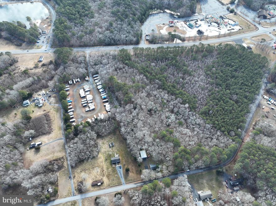 Discover the potential of this 6.5-acre parcel ideally situated just off Route 611 and Lewis Road. No perk test has been completed. The existing mobile home and house on the property are teardowns. The property may offer the possibility for two EDUs (buyer to verify with county). Enjoy a fantastic location just off Stephen Decatur Highway, only minutes from the beaches of Ocean City and Assateague Island. Downtown Berlin is also just a short drive away, offering charming shops, dining, and small-town appeal. Great opportunity to build in a highly desirable area with convenient access to beaches, recreation, and town amenities.