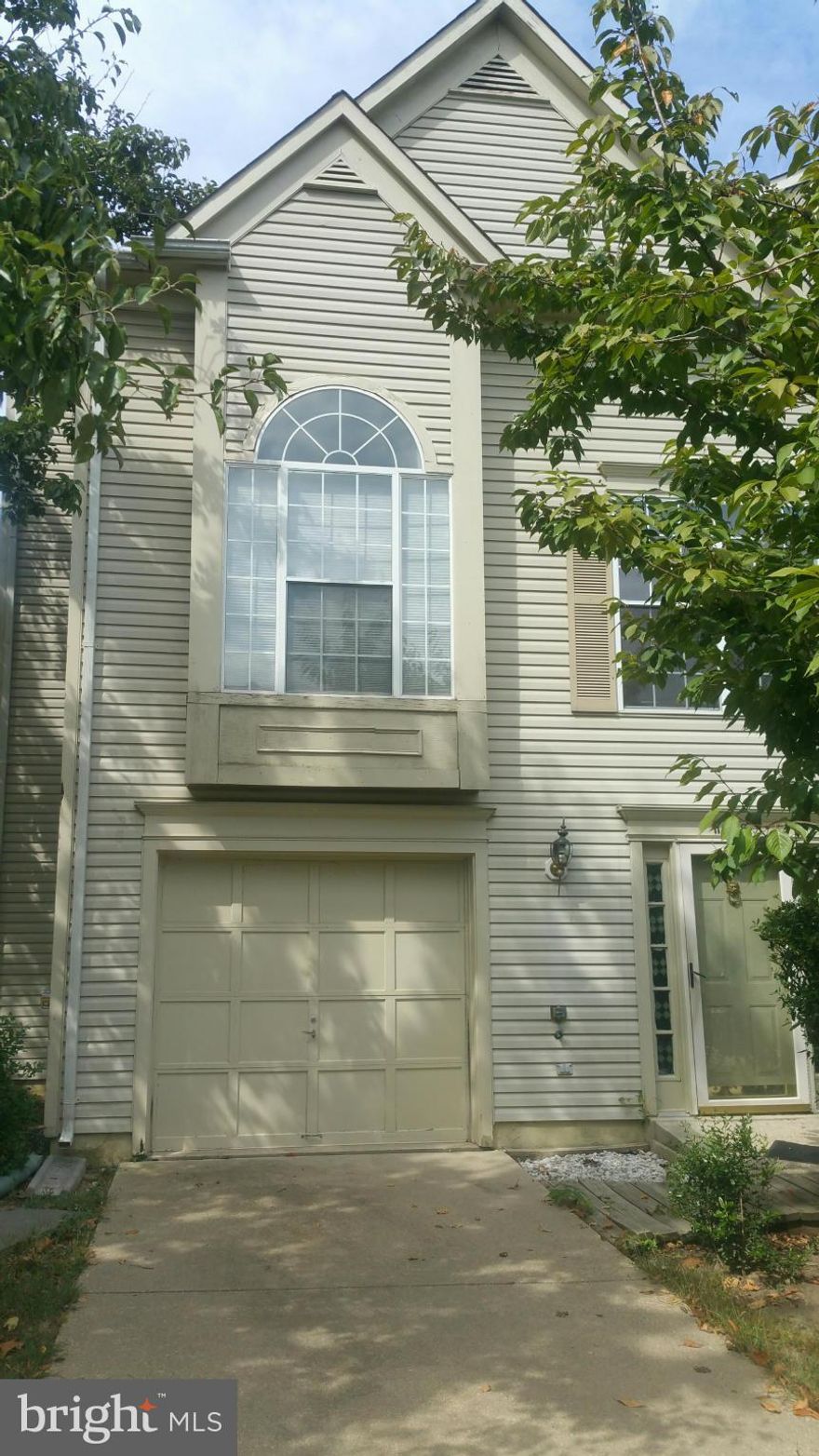 THIS IS A WINNER!  Cathedral ceilings, main level master with soaking tub, his/her sinks, separate shower and deck... large family room w/fireplace on the walk in level...full deck, fenced yard ,recent AC.... end unit..garage..priced to sell.  Over 2300 living area waiting for a new owners personal touch to make it a true HOME!  Sold strictly AS IS