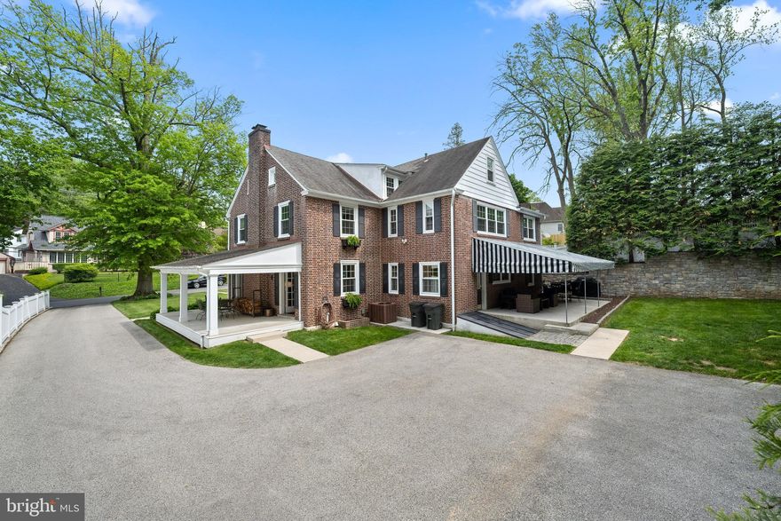 Charm abounds from this gracious three story brick colonial that has graced the South Wayne community for the last 83 years.  Its captivating street presence begins with a carpet of green grass setting the tone for this "picture perfect" beauty and  grabbing your heart from the moment you arrive.  A lovely flagstone walkway gracefully carries you  
to the front door where one is welcomed by a traditional Foyer flanked by formal Living and Dining Rooms.  Some of the features include beautiful built-in bookcases, wood burning fireplace, extensive millwork, and 2 sets of French doors that lead to a covered outside Porch. In 2008 the original footprint of the home was expanded and gleaming hardwood floors connect the old and the new offering a wonderful circular flow on the First Floor. The back of the home features a beautiful  Kitchen with every chefs delight  overlooking the private  backyard oasis and exquisite awning covered Patio offering a fabulous outside room.  A cozy Family Room is conveniently located off of the Kitchen with a Laundry Room, Powder Room and Mudroom completing the First Floor.  As one ascends to the Second Floor an amazing Primary Suite awaits flooded with natural sunlight featuring two large walk-in closets, updated Primary Bath, and outside deck offering a private sanctuary you will ever want to leave. On the Second Floor there are 3 additional  Bedrooms , and an updated Hall Bathroom. The Third Floor features 2  Bedrooms with additional flexible space perfect for Playroom or Office. This stunning home truly has it all... in a location minutes from the Radnor Trail, within walking distance to downtown Wayne, and  close proximity to all major highways!! Don't miss this opportunity to own this gem in one of Radnor Townships most sought after neighborhoods!!