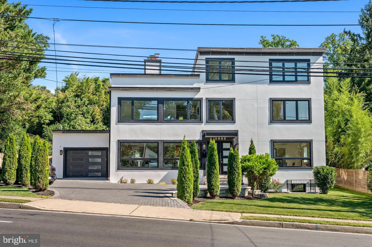 Spectacular Contemporary Home – Fully Rebuilt in 2023 .4 Finished Levels | 6,000+ Sq Ft | Prime Bethesda Location
Welcome to this exceptional custom-built contemporary home, ideally located along Massachusetts Avenue in the coveted Bethesda High Point neighborhood and within the prestigious Whitman High School cluster.
Boasting over 5,000 square feet across four finished levels, this modern residence offers luxury living with high-end finishes, smart-home integration, and versatile spaces ideal for multigenerational needs.
Main Level:
Open concept design with wide white oak flooring, coffered ceilings, custom iron railings, oversized Andersen windows, and a gas fireplace. The gourmet kitchen features Monogram commercial-grade appliances, Black Galaxy granite countertops, custom cabinetry, and a large island—perfect for entertaining.
Upper Levels:
Second level includes 3 bedrooms, 3 full baths, and laundry. The expansive primary suite features a spa-like bath with a two-person rain/steam shower, freestanding soaking tub, and a custom walk-in closet. The top floor offers a 4th bedroom/office, full bath, wet bar, and two private roof decks with solar lighting and built-in sound system.
Lower Level:
Fully finished basement with a 5th bedroom, full bath, rec room, play area, mechanical room, second wet bar, and a wood-burning fireplace. Ideal for guest suite or in-law/au pair setup.
Smart Home System:
Controlled via the Emergent Home Solutions platform—manage lighting, climate, garage, locks, cameras, sound system, and Wi-Fi from your phone or tablet.
Additional Features:
Paver driveway & stone patio
Oversized one-car garage
Dual-zone HVAC with 2 gas furnaces
Over $270K in recent upgrades: new roof & gutters, full basement renovation, solar panel system, luxury sauna, EV charging stations (2), and high-end motorized blinds throughout
Location:
Minutes to DC with easy commuter access. Across from the beautiful Potomac River parks and trails.
This is a rare opportunity to own a truly move-in-ready contemporary home in one of Bethesda’s most desirable communities.