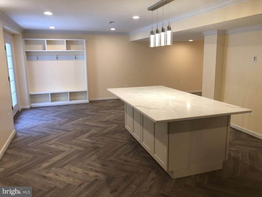 Welcome to 6623 Broad Creek Overlook – a spacious and fully finished basement apartment offering a perfect blend of comfort and convenience with LVP flooring throughout! This bright and open unit features 1 bedroom and 1-bathroom with a double sink vanity and fully tiled shower, recessed lighting and wall sconces, a modern kitchen equipped with updated stainless-steel appliances, quartz countertops, white cabinets, tiled backsplash, and a large island. There is a cozy living area ideal for relaxation with a wall mounted electric fireplace, and a separate office space that could double as a bedroom. Enjoy private access, in-unit laundry with a front-loading washer and dryer, and ample storage throughout including a built-in coat rack at the entrance. The ceilings and primary bedroom walls have been soundproofed for added privacy. ALL UTILITIES ARE INCLUDED, and feature trash pick-up and high-speed FiOS internet with premium channels and two access points. 

There is a beautiful lighted walkway with railings leading to the separate entrance of the unit. The property is nestled in a quiet neighborhood with beautiful views, yet is just minutes away from local shops, dining, and major commuter routes. Don’t miss the chance to live in this serene, highly sought-after community!