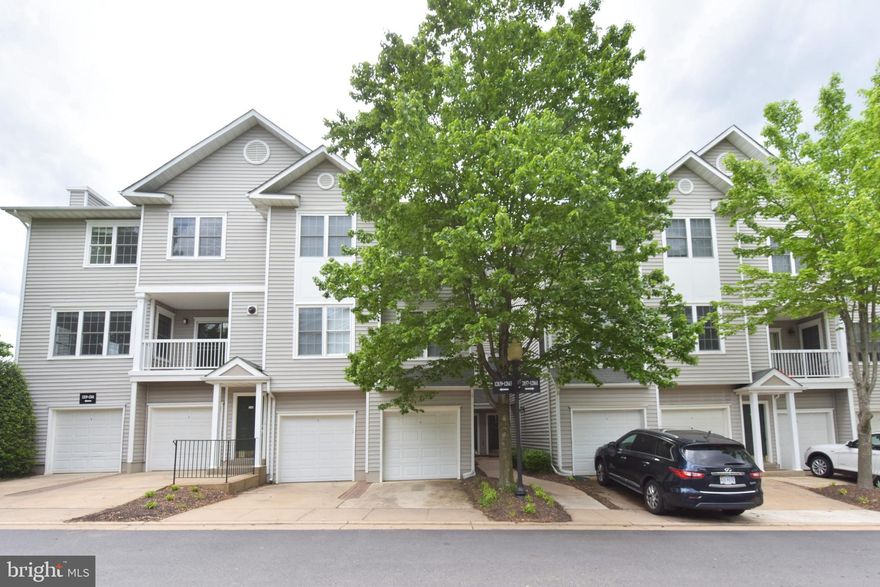 Beautifully updated 2BR/2BA home w/attached garage & balcony in convenient location close to great shopping & dining! Beautifully updated, gourmet kitchen with granite  and high-end stainless appliances.   Primary bedroom with huge walk-in closet and en-suite bathroom.  Secondary bedroom with bathroom for convenience! Living room w/stone surround fireplace, new flooring throughout - don't miss this one!