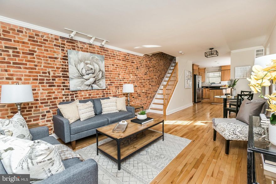 This end unit rowhome with 2 bedrooms, 2 bathrooms,  a finished basement, rooftop deck, and hardwood floors is available May 15th, 2023. The extra windows on the main level make the living room, kitchen, and dining areas so inviting, as the light bounces off the hardwood floors. The kitchen features stainless steel appliances, granite counter tops with an island breakfast bar overhang, and two pantry closets. Upstairs the hardwood floors continue and features a large front bedroom with a generous size closet, a hall bathroom with separate shower and tub, and a rear bedroom. The finished basement space could be a guest room, with a window and closet, and a full bathroom. Washer and dryer is located in the basement.  Garage fits a compact vehicle (Civic, Carolla, etc). Available May 15th to allow for current tenants to move out and property made ready for new tenants. Application fee is $35 per adult applicant. 650+ credit score required and household income to meet or exceed $100,000.