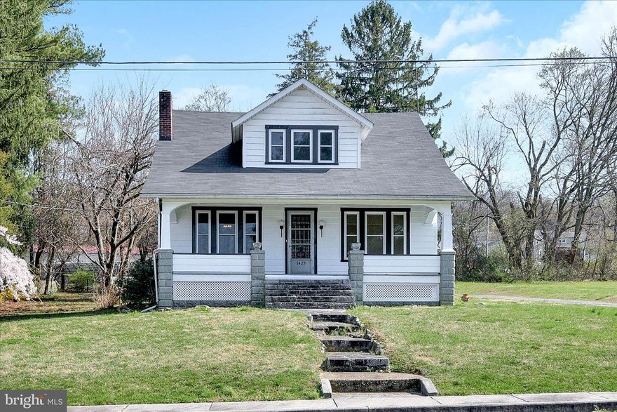 This move-in ready, historic 1930s craftsman-style bungalow in rural northern Harford County is waiting for you! From the charming and expansive front porch with natural stone accents to its quintessential dormer this home is an exquisite example of this elegant and celebrated architectural style.
Inside, custom original millwork, molding, trim, built-ins, doors and hardware are in impeccable condition. This welcoming and spacious home features four bedrooms, a large dining room, a 2 car garage, a sizeable full basement, and plenty of outdoor space for entertaining.
New owners will also have peace of mind knowing the home was recently updated including the following improvements: heating and air conditioning system (February 2023), Kinetico water filtration system (January 2023), bathroom remodel (January 2023), luxury vinyl plank flooring throughout first floor (September 2022), replacement windows installed in entire home (June 2022), hot water, pressure tank, & sump pump (September 2021), asphalt shingle roof (May 2014). The property is also served by public sewer, providing the potential for future improvements in the spacious back yard.  The adjacent building lot will be available soon allowing your family the ability to create a family compound.