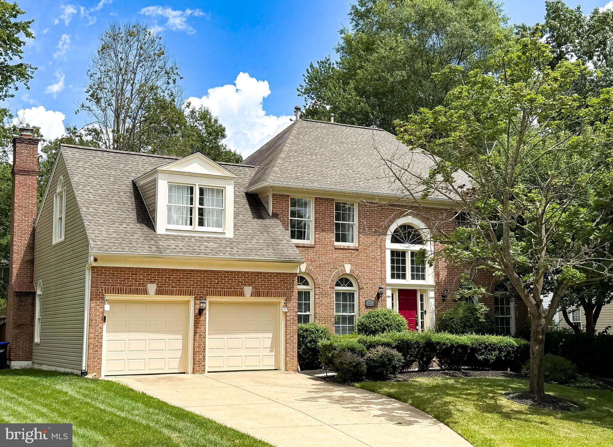 Elegant Brick Estate in Coveted Barrington! Welcome to this exquisite 4-bedroom, 3.5-bath brick-front estate nestled in the prestigious Barrington community. Boasting three expansive finished levels and timeless curb appeal, this home offers refined living in one of Fairfax County’s most desirable neighborhoods. Step into a dramatic two-story foyer flanked by a private office with French doors and a formal living and dining room—ideal for elegant entertaining. The updated gourmet kitchen is a chef’s dream, featuring gleaming granite countertops, rich cherry cabinetry, a center island, custom vent hood, walk-in pantry, and stainless steel appliances. The sun-drenched breakfast area flows seamlessly into the stunning vaulted family room with a soaring floor-to-ceiling stone fireplace and French doors leading to a sprawling rear deck—perfect for hosting under the stars. Upstairs, the spacious bedroom level showcases four generous bedrooms and two full baths, including a luxurious primary suite with a cozy sitting area, multiple closets, and a spa-inspired bath with dual vanities and a soaking tub. The fully finished walk-up lower level is an entertainer’s paradise, complete with a custom home theater, stylish wet bar with solid surface countertops and beverage fridge, a gym with rubber flooring, built-in workstations ideal for a home office or study area, and a versatile bonus room perfect for gaming, guests, or additional storage. **BRAND NEW ROOF***Enjoy all that the distinguished Barrington community has to offer—over 400 executive-style homes nestled in a park-like setting, just minutes to Burke Lake, Lake Mercer, South Run Recreation Center, and convenient access to the Fairfax County Parkway and I-95.
