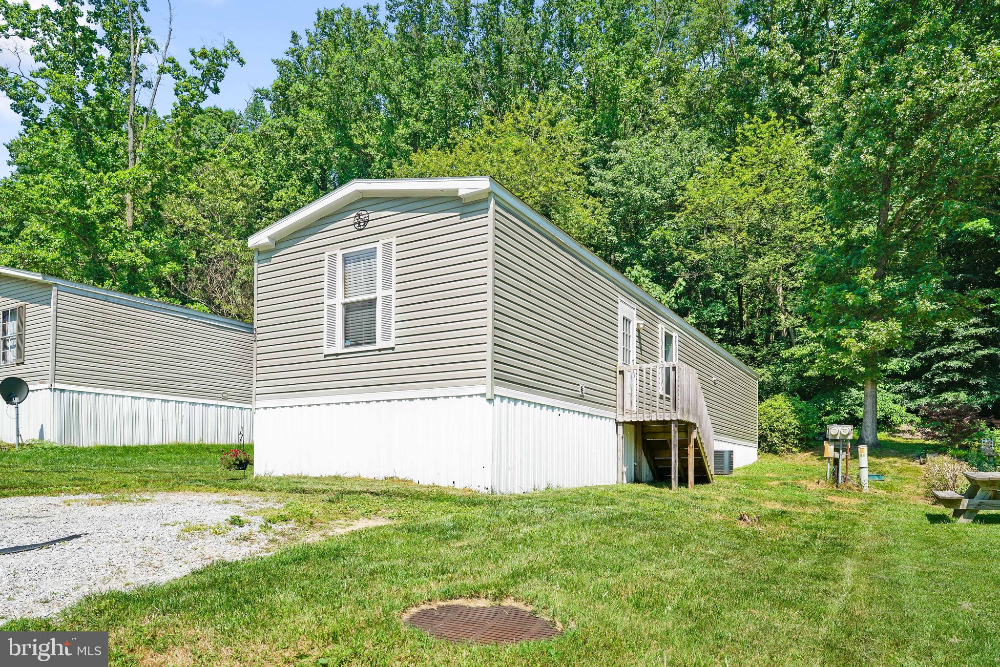Located in the sought after Rock Creek Mobile Home Park, this 16 x 70 single wide features a bright and open floor plan and has 3 bedrooms and 2 Full baths. The primary bedroom has an en-suite and walk in closet at one end and the other two bedrooms are at the opposite end. Appliances include a washer, dryer, refrigerator, stove, and dishwasher. A shed is included as well. Lot rent is $603/month and includes water, trash, and sewer. No property taxes. Must be park approved. Financing can be obtained through APGFCU. Close to I-95 and Rte 40!