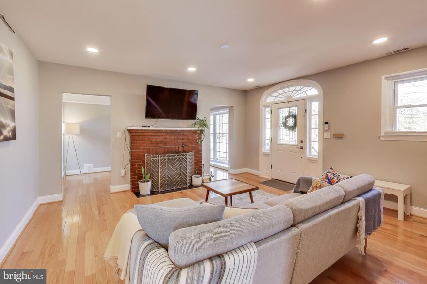 You'll be stunned at how spacious this heart of Hyattsville home is given it's compact colonial exterior! At over 2700 total square feet, with 5 legal bedrooms and 4 full baths on three levels, you'll have plenty of space to spread out, host family & friends, and even invite multi-generational living, a nanny, or even house hack a short term rental in the basement.

Elevated off street level with newly rebuilt stairs & walkway and a beautiful terraced front yard, you'll enter this home from a lovely front deck - perfect for a morning coffee, evening glass of wine, or a quick chat with a neighbor. On entry, you are greeted with a gracious wood-floored living room with a fireplace that flows gently into the sitting room with access to the rear yard. You'll notice the rear entrance has been totally rebuilt with code compliant stairs for a safe and easy exit into the fenced yard.

To the left of the living room, a renovated kitchen boasts shaker cabinetry, stainless steel appliances with a Samsung smart fridge, gas oven, built in microwave, and dishwasher. The kitchen has an exterior entrance to the front yard, for easy grocery load-in. Beyond the kitchen is a large dining room with great light and views of the back and side yards. Completing the main level privately tucked into the back of the house is a full bathroom and bedroom - great for guests or workable as a first floor primary suite.

Upstairs, you'll find three additional bedrooms and two full baths. The capacious primary suite easily fits a king size bed, with multiple large closets and an en suite bathroom. The previous owners deck build off the primary suite was removed because it wasn't permitted nor safe - but the egress door facing the rear yard (currently blocked off for safety) remains for a new owner to add their own balcony perch or full deck, if they prefer. Across the hall, two additional bedrooms each have room for a queen bed with plenty of closet space and share the hall full bath with tub.

The lower level of the home is accessible both from an interior staircase and an exterior stair on the side of the house. Downstairs, you'll find a wetbar - sink, lower cabinets, and an additional microwave that conveys, as well as space for a full size or beverage fridge. The large rec room space is great for a play area, living room, work out zone, or additional office/study space. Beyond the living room, you'll find a legal bedroom with a code-compliant egress window and en suite full bathroom. Completing the basement is a very large full finished utility room with laundry - and the basement is laid out nicely to allow a future owner to easily wall off the entrance to the interior stairs and share the utility room with a downstairs tenant, if one so desires.

Outside, the large rear yard is fenced in with a large storage shed, a firepit and plenty of space for play, entertaining, or gardening. With a south facing rear yard - you'll get great light year round for your plants of choice. This home is just a quick 5 minute walk to the Hyattsville Metro station, PG Plaza Mall with Target, TJ Maxx, Giant and Safeway, as well as nearby neighborhood favorites - Franklins, Vigilante Coffee, Burtons, Shagga Coffee, and Manifest Bakery. You'll also find an abundance of nature options nearby - King Park, Anacostia River trail, Driskall Community Park, and the Mt. Rainier Nature Center. For commuters, Riverdale Marc station is a quick 10 minute drive away! This tight-knit community is a great place to call home!

Homeowner updates include:
ADA-compliant and fully permitted entryway stairs and back landing
Converted basement room into full bedroom with egress window and sump pump
New roof
New washer and dryer
New water heater and control panel
New lifetime warranty gutter guards
Updated shed with weatherproof flooring