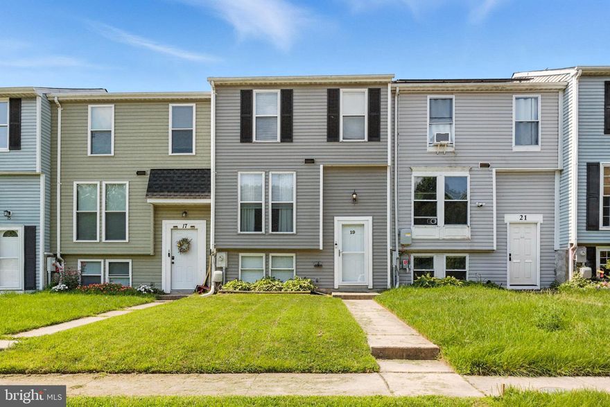 Absolutely adorable townhome in Middle River!  No HOA fees! 3 bedrooms and 2 full bathrooms! The main and upper levels feature wood floors. The upper level has 2 bedrooms and a full bathroom with double sinks! The living room has a walkout to a wonderful, private deck - perfect for entertaining! The lower level has a 3rd bedroom, another full bathroom and a level exit to the fenced rear yard.  Full size washer and dryer convey!  This home is in move in ready and easy to show!