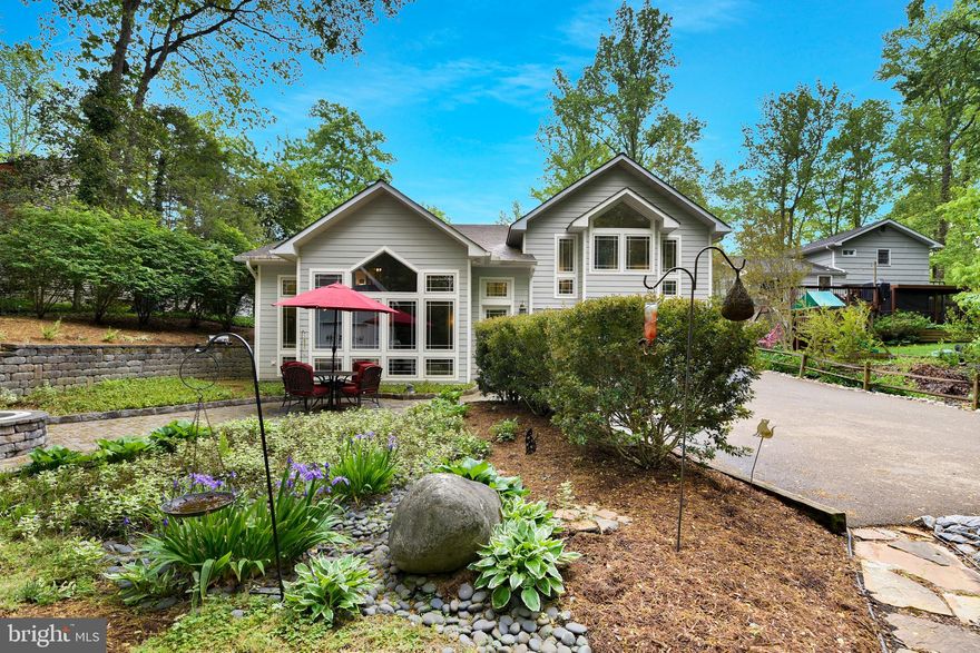 Tucked away along a quiet private road, 278 Cape Saint John Road greets you with an understated charm that quietly hints at something far more extraordinary beyond. At first glance, the home feels quaint and unassuming—but as you turn onto the driveway, marked by its whimsical dragonfly mailbox, the experience begins to unfold.  Surrounded by lush, manicured greenery, the approach is nothing short of enchanting. Towering glass windows at the main entrance reflect the natural beauty that envelops the property, creating a seamless connection between the home and its serene surroundings. Step inside, and you’re immediately captivated by a breathtaking floor-to-ceiling glass wall that frames the expansive living room. Here, soaring cathedral ceilings elevate the space, while an elegant staircase rises gracefully to the second floor, setting the tone for the home’s architectural beauty.
Wander further, and the home reveals itself like a collection of carefully curated surprises. Around each corner, a new feature awaits: a stylish wet bar perfect for entertaining, a thoughtfully designed laundry room, a full bath complete with a luxurious soaking tub, two massive rooms you can use your imagination . A secondary staircase adds both convenience and character, leading seamlessly back to the main level.
The living spaces are as generous as they are inviting. Three oversized bedrooms offer comfort and retreat, complemented by a newly renovated bathroom and an updated kitchen designed for both everyday living and effortless hosting. Custom closets add a touch of tailored sophistication, while a sun-drenched entertainment room provides the perfect setting for gatherings or quiet afternoons alike.
The home’s spacious foyer welcomes you toward the front entrance, where vibrant flowerbeds and mature trees create a natural sense of privacy—an intimate escape that feels worlds away. And yet, this tranquil haven is ideally located just minutes from the charm and energy of Annapolis, with the Cape Saint John community beach and boat ramp just around the corner.
This is more than a home—it’s a hidden retreat where elegance, comfort, and nature exist in perfect harmony.