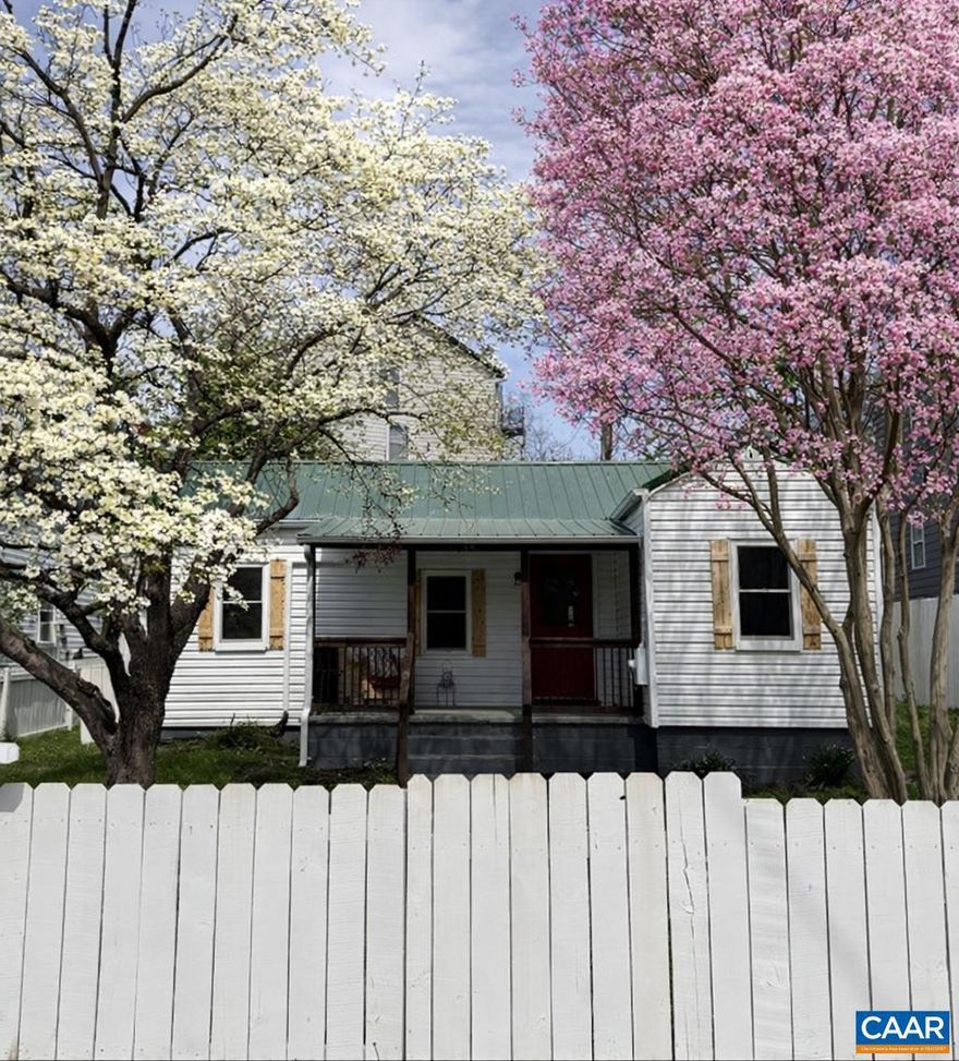 This darling Belmont cottage packs a punch! You will adore the white picket fence the surrounding the front yard, and the covered porch where you'll enjoy the view of Carter Mountain and watch baseball games right across the street at Quarry Park. The new metal roof adds to the charming exterior style and vintage flair.  Inside, the home has been completely renovated and features modern conveniences throughout.  New white shaker cabinets are found in the kitchen plus sleek stainless appliances, and a large tiled shower in the bathroom. Ductless HVAC systems were added for heating and cooling. There?s even a spacious mudroom off the back with a sliding barn door. At 850 square feet, it's cozy but smartly laid out with 2 bedrooms plus an office. Just 1 mile to the Downtown Mall, minutes to UVA, and around the corner from I64, it's a great location! If you're looking for an affordable, low-maintenance, move-in ready home in a fantastic location, this one's got the charm and the updates to match. Don't miss this opportunity to see this one before its gone!,White Cabinets
