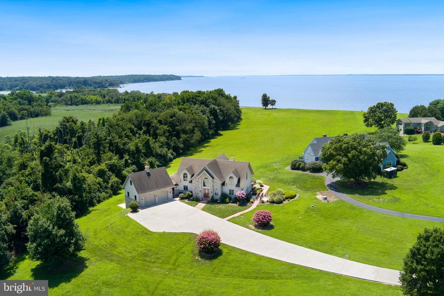 "SKIPPER'S CHOICE" - Virtual Waterfront Home on the Upper Chesapeake Bay/Elk River!   Enjoy breathtaking sunsets!  Experience expansive water views from nearly every room in this exceptional 4 bedroom, 4 1/2 bath contemporary home situated on the banks of the Elk River.  Designed for comfort and style, the open floor plan is filled with natural light and features a striking floor-to-ceiling stone gas fireplace in the great room - perfect for cozy gatherings.  The main level offers a spacious master suite with its own fireplace, a sliding door to the back deck, and serene water views.  The kitchen is outfitted with granite countertops and flows into the dining area and sunroom, both with easy access to the deck.  Upstairs, a loft overlooks the water and separates two generously sized bedrooms, each with its own full bath - ideal for guests or family privacy.  The finished lower level is an entertainer's dream, complete with a full kitchen, media/theater room, and two additional bedrooms with walk - out access to the covered patio.  Additional features include a two - car garage with an upper storage area, plus a separate rear garage for water toys and equipment.  A deeded boat slip with lift at the community beach is included - perfect for enjoying all the river has to offer.