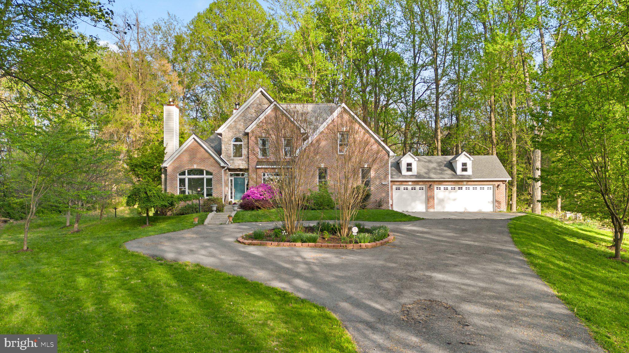 As seen on "If You Lived Here" Season 3 episode 4! This incredible home is the one you've been waiting for. Tucked back on a tree-lined 2-acre lot with loads of windows everywhere you turn to take full advantage of your gorgeous views! Just off the grand entry, you will find the office/den that comes complete with its own fireplace! The great room welcomes you with open sight lines to the back deck, kitchen, and dining room. Don't miss the gorgeous sunroom just past the kitchen! Through the formal dining room with elegant touches, you will find a second family room/formal living room with another grand fireplace. Don't miss the primary suite on the main level! Four additional bedrooms and two full baths upstairs, and an incredible fully finished basement with walk-up stiars round out this absolute gem. You won't want to miss it so call us to schedule your private showing today!