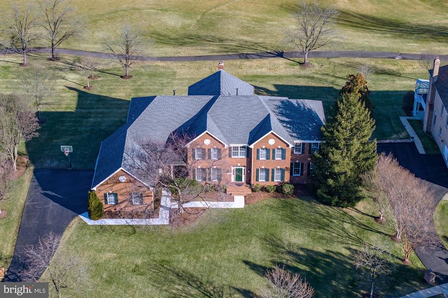 "It's all about the Lot, Location and Bones" of this Chesapeake Federal Model!  Situated on a Hillside  Overlooking the 10th (Signature) Hole, Is this Full Brick Home from the Masters Collection!  With Almost Every Structural Option that Toll Brothers offered, This Home Offers Tremendous Flexibility!  The Home Backs to the East Enjoying the Morning Sun and Afternoon Shade.  It features Gorgeous Views of the Golf Course and Pond!  This Great Location Allows for a Quick Walk to the Country Club, Shops & Restaurants at Belmont Chase & The Belmont Recreation Center!  Over 8,500 sf, 6 BR's & 6.5 BA's, Finished Walk-Out Lower Level with Theater & Game Room!  Recently Built TREX Deck & Stamped Concrete Patio!  Huge, Flat Backyard!  Most Desirable Location in Belmont Country Club!