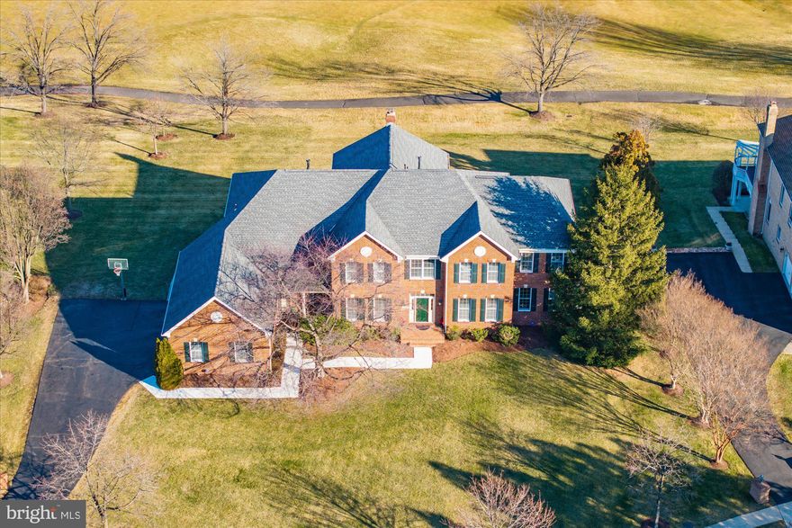 "It's all about the Lot, Location and Bones" of this Chesapeake Federal Model!  Situated on a Hillside  Overlooking the 10th (Signature) Hole, Is this Full Brick Home from the Masters Collection!  With Almost Every Structural Option that Toll Brothers offered, This Home Offers Tremendous Flexibility!  The Home Backs to the East Enjoying the Morning Sun and Afternoon Shade.  It features Gorgeous Views of the Golf Course and Pond!  This Great Location Allows for a Quick Walk to the Country Club, Shops & Restaurants at Belmont Chase & The Belmont Recreation Center!  Over 8,500 sf, 6 BR's & 6.5 BA's, Finished Walk-Out Lower Level with Theater & Game Room!  Recently Built TREX Deck & Stamped Concrete Patio!  Huge, Flat Backyard!  Most Desirable Location in Belmont Country Club!