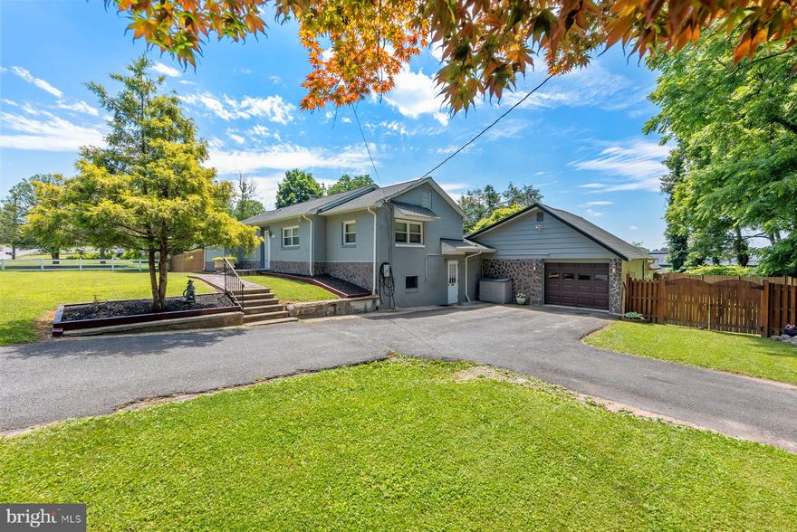 Absolutely stunning private Estate like home For Sale! This amazing house sits on an amazing 1+ acre double wide parcel. Meticulously maintained grounds with outdoor living space like no other. 2 large Covered patios perfect for all your entertaining needs. Outdoor cooking area. Main level greets you with an open floor plan living, large and bright living room, dining room and a kitchen. Updated bath and 2 generous size bedrooms. Few stairs down you find yourself in the Owners quarters or an In-law suite furnished with a full size kitchen and island dining space and another living room with sliding doors to the outdoor oasis. Tastefully updated bath completes this level. Fully finished lower level with another 4th bedroom and supersized family room. Designated laundry area and plenty of storage. Large garage with plenty of additional storage. Driveway with space for 4-6 cars with room for more in the back. The 2nd part of the property lot features a small  creek and serene nature environment. Great location close to schools, i83, 695, 95 and more.