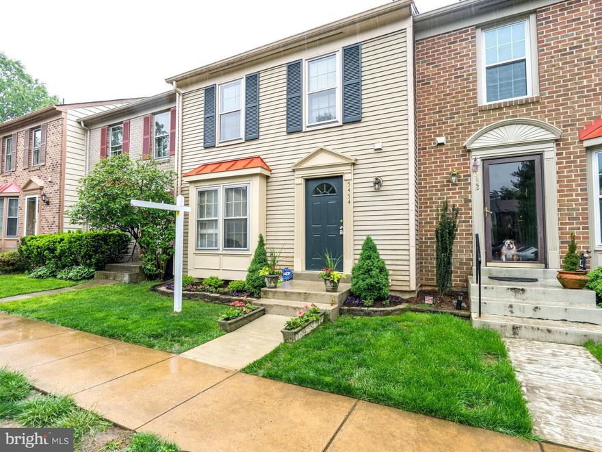 Updated three level townhome in spectacular location. Fully renovated kitchen w/granite & SS appliances. New carpet lower and upper level, new paint. HW floors on main level. Tons of storage. Walk out lower level to fenced backyard & patio. Large deck. FP in rec room plus half bath. Close to top rated schools, great for commuters and lots of amenities. Assigned parking.