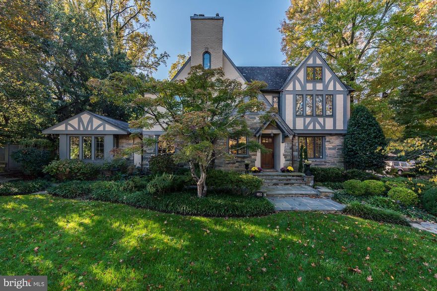 Exquisite residence with a stately Tudor exterior and smashing contemporary interior - on one of D.C.'s most desirable streets! This smart renovated property blends a traditional exterior befitting the neighborhood with a chic, fresh interior, and offers a heated pool and patio space on sprawling landscaped  grounds. Four finished levels provide 8100 sq ft of custom renovated living space, 6 BRs, 6.5 BAs, and a 2-car attached garage. A grand entry foyer leads to  beautiful Living Room with coffered ceiling, large formal Dining Room, and expansive Great Room with doors to the patio. Large contemporary Kitchen with marble center isle and banquette seating. Wonderful flow from space to space, exceptional windows, beautiful hardwood floors, exquisite trim work, custom built-ins and fixtures, create the perfect environment for entertaining and every-day living. The first upper level offers a Primary Suite with a large Bedroom, smashing renovated bath, closets, and sitting area with built-ins. Three addition bedrooms on this level share two renovated baths. The top level offers an additional bedroom, and wonderful Office or play space. The lower level offers a large Recreation Room, au pair suite, separate laundry room and large wine cellar. Truly an exquisite property and rare offering.