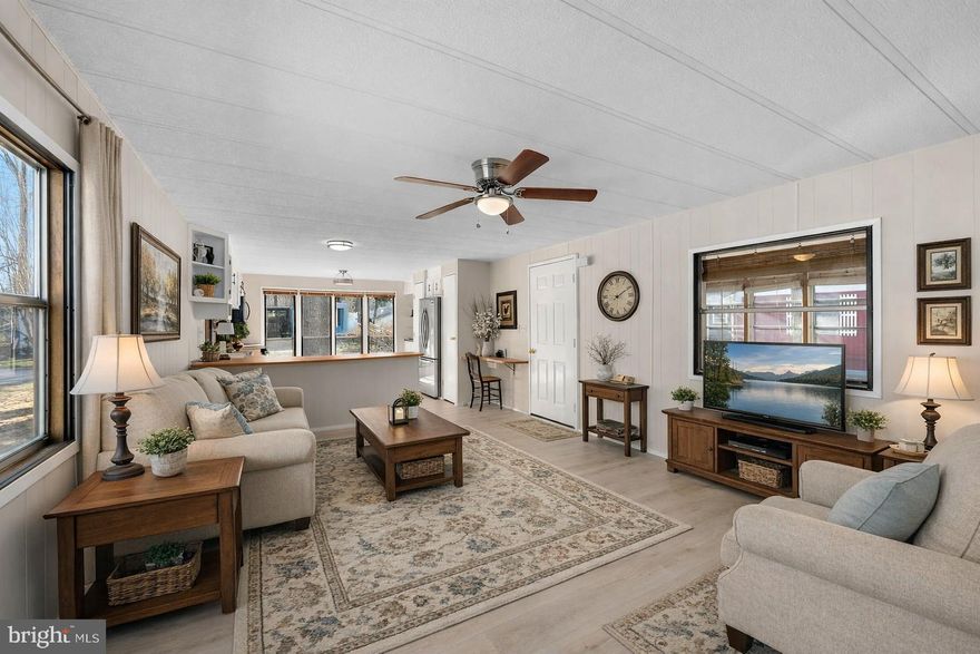 **PRICE REDUCED !- This charming two-bedroom, one-and-a-half-bathroom single-wide home features an open floor plan along with an enclosed sun porch and back deck. The home is situated in Sweet Briar Mobile Home Park, adjacent to a serene wooded buffer. The kitchen is equipped with brand new stainless steel appliances, modern lighting, and luxury vinyl plank flooring and fresh paint throughout. For those seeking outdoor activities, the Red Mill Pond boat ramp offers an excellent opportunity for a day on the water or fun fishing from the pier. Alternatively, if you prefer to relax closer to home, the community pool and clubhouse are available for your enjoyment. Don't forget you are just 6.7 Miles to the nearest beach if you want to get your toes in the sand!!
Additionally, ample storage is provided by a sizable shed, perfect for housing tools and recreational equipment. The ground rent covers: access to the boat ramp, community pool, trash collection, and lawn maintenance. Please schedule your showing today! 

The Home has been virtually staged inside & outside for you to see the wonderful potential this home has to offer.
