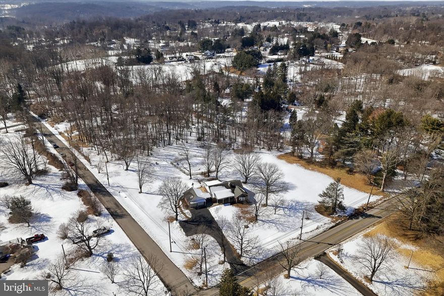 Potential to SUBDIVIDE into 2 lots. Welcome to 1304 Valley Road in desirable Edgmont Township, a rare opportunity to own a charming brick ranch set on just over 4 picturesque acres in the award-winning Rose Tree Media School District. The sprawling 4.03 acres is relatively flat and borders Valley Road and Yarnall Lane for easy access. (Potential for Subdividing) This impeccably maintained 3-bedroom, 2 full-bath, and 1/2 bath home , offers the perfect blend of privacy, comfort, and functionality. Front and back covered porches invite you inside, where you’ll find a spacious living room highlighted by a large bay window that fills the room with natural light and a stone fireplace with a raised hearth. The dining room features an expansive picture window overlooking the serene backyard, creating a beautiful backdrop for everyday meals or special gatherings. The sizable kitchen offers abundant counter space and cabinetry, ideal for both daily living and entertaining. The primary suite includes a 1/2 bath, while two additional generously sized bedrooms share a full hall bath with tub/shower. The partially finished basement expands your living space with a second kitchen, full bath, and wet bar with seating for 4+, perfect for entertaining, hosting guests, or creating an in-law or recreation area. Bilco doors provide convenient access to the backyard. The unfinished portion includes a laundry area, ample storage, and dedicated workshop space.  Attic space for extra storage. Step outside to your own private retreat featuring an inground pool with a new split-rail fence and expansive grounds, offering endless possibilities from gardening to outdoor entertaining. The home is also equipped with a portable generator and a 6-circuit hookup for added peace of mind. Covered back patio overlooking the pool area. A 2-car detached garage, connected by a breezeway, can be a flexible space for storage or other use. Ideally situated just minutes from Sleighton Park, Edgmont Township Park, Tyler Arboretum, and Ridley Creek State Park, this location offers endless opportunities for hiking, biking, and year-round outdoor recreation. Enjoy local favorites like dinner at La Porta, breakfast at Country Deli, or a wine tasting at Grace Winery. You’re also just moments from the charming shops, dining, and community events in the Borough of Media. Convenience continues with nearby shopping, restaurants, and fitness centers at Granite Run Promenade and The Shoppes at Brinton Lake. Commuters will appreciate easy access to 352, RT 1, and West Chester Pike. The New Wawa Train Station is just a short drive from home. Seasonal fun awaits at Arasapha Farm, and garden enthusiasts will love being close to Wedgewood Gardens. Golf lovers will enjoy several courses nearby, including The Golf Course at Glen Mills, Concord Country Club, and Penn Oaks Golf Club. This prime location truly offers something for everyone. This exceptional property combines tranquil living with suburban convenience. Don’t miss your opportunity to make this stunning property your forever home — schedule your private showing today. Home is where your story begins! Note: Lot lines on pictures are approximate; buyer to verify.