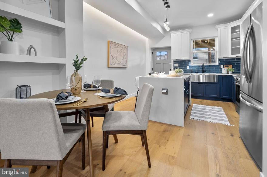 Welcome to 3306 E Lombard Street — Where High Design Meets Everyday Comfort This fully renovated 3-bedroom, 3.5-bath rowhome in East Baltimore checks all the boxes for a buyer who wants stylish finishes, smart design, and walkable city living without the noise or hassle. 

Step into a sunlit main level featuring rich hardwood floors throughout, a sleek electric fireplace, and a modern metal slatted accent wall that brings personality to the space. The kitchen is a true showpiece, designed for both beauty and function — complete with a dramatic waterfall island, drawer storage, and custom lighting that creates the perfect mood for anything from brunch to wine night. Upstairs, you'll find two spacious bedrooms, each with ceiling fans and great closet space, plus two full bathrooms with automatic lighting and high-end finishes. The top floor even includes a private deck — perfect for enjoying your morning coffee or watching the sun set over the city. The fully finished basement offers a third bedroom, another full bath, and a flexible space ideal for guests, a second living room, or your dream home office setup. 
A convenient half bath on the main floor makes entertaining easy, and every detail in this home feels thoughtful and elevated. While the home offers street parking, you'll quickly fall in love with the walkable neighborhood, where Patterson Park, local cafes, shops, and restaurants are just minutes away. This block is quiet, charming, and ideal for anyone craving a mix of city energy and personal peace. 
Best of all, this home qualifies for Baltimore City grants for first-time buyers, making it a smart and stylish move for your future. Ready to fall in love? 
Schedule your private tour of 3306 E Lombard Street today.