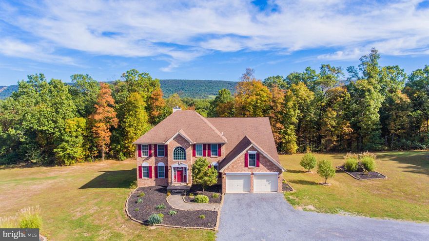 STUNNING best describes this property.  Spacious colonial with 4 BR, 3.5 BA on 23 Acres with only ONE restriction (no further subdividing)  Main level features foyer, open dining and kitchen, living room, laundry room,  & office with wood floors.  Upper level has 4 BR, 2 BA,   Finished basement has den, family room with bar area and plenty of storage.  Large screen deck off main level kitchen/dining areas.  2 car attached garage + a 2+ car detached pole barn with finished, heated, fitness area.