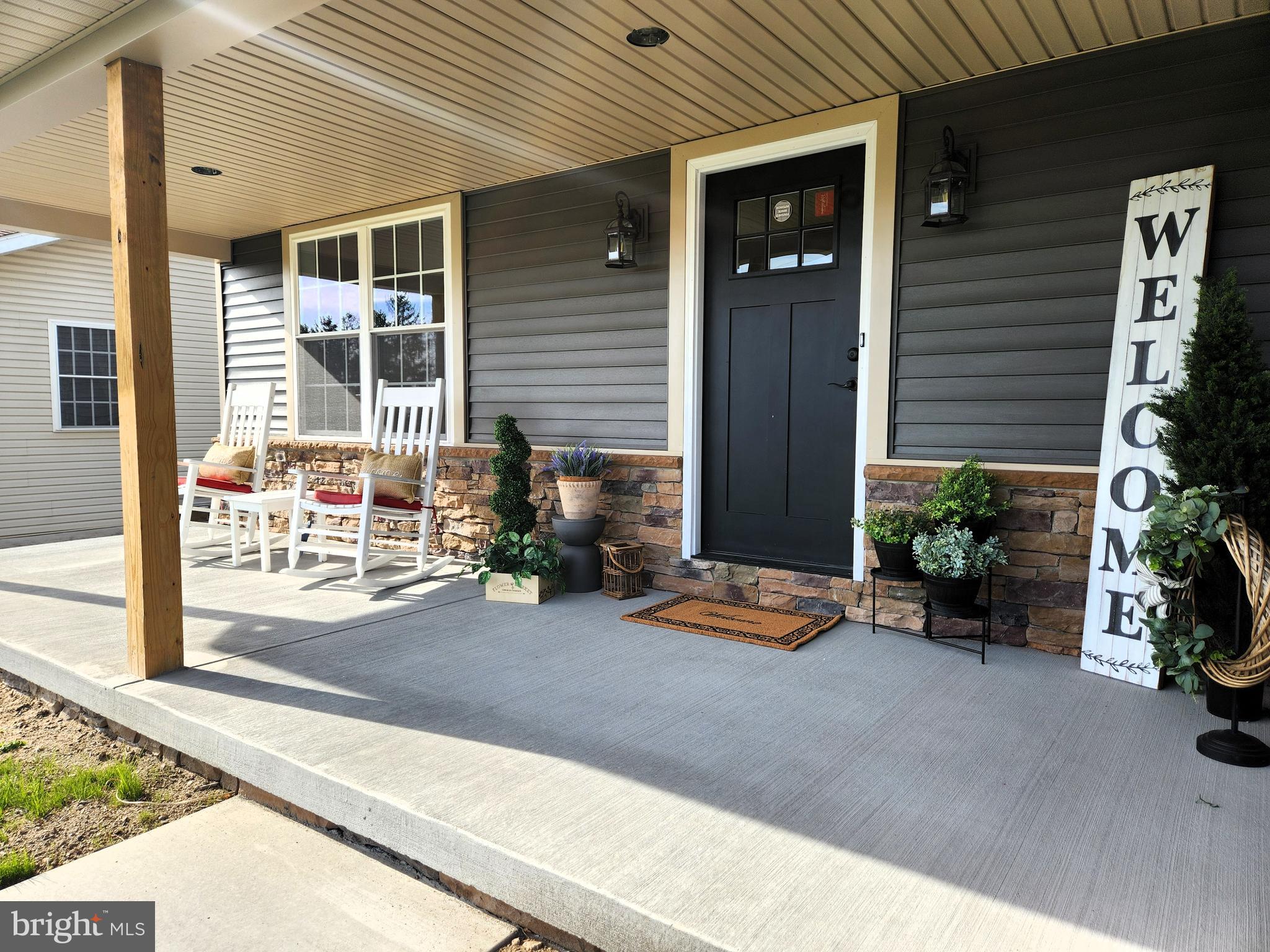 ** OPEN SUNDAY 5/18 from 1 to 3 ** BEAUTIFUL and BRAND NEW! With over 2,600 square feet and located on a level 1/3 acre lot, this stunning 4 bdrm, 2.5 bath home is almost move-in ready! Be forever greeted by the welcoming 8x24 front porch, purposely oversized to allow plenty of space to gather with friends and family. The entire 1st floor, including the living and dining rooms, is adorned with the same wide width luxury vinyl plank flooring as seen on HGTV’s “Love It or List It” and is touted as waterproof and pet proof! The kitchen features trending two-toned cabinetry in mineral gray lower and snow-white upper cabinets and an oversized 8 foot island with granite counters and upgraded stainless appliances with “air fry” technology. The breakfast area features sliders leading to the rear 12x16 patio offering serene mountain views. A spacious formal dining room, a vast family room, a large kitchen pantry and hall coat closet and elegant foyer all compliment the first floor. Upstairs you’ll find the massive owners suite highlighted by a full bath with stand-alone soaking tub and a walk-in shower plus a spacious walk-in closet. The second floor is completed by 3 additional spacious bedrooms and an oversized main bath with laundry and closet. Many additional features including an oversized 2 car garage with opener and upgraded basement Superior Walls are pre-insulated and pre-studded is an easy finish for future expansion & means no unsightly plastic insulation blanket to tend with! All located within walking distance to schools, close to shopping and all major highways with no HOA fees! Listing Agent has financial interest in the property.