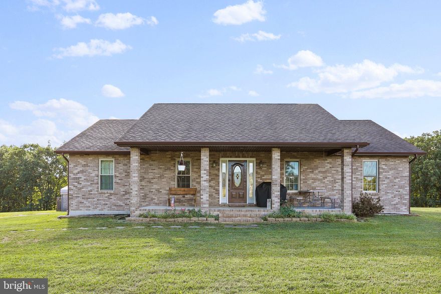 COME AND SEE THIS LOVELY RANCH HOME WITH A LARGE DETACHED HEATED GARAGE/WORKSHOP THAT HAS AN APARTMENT WITH ITS OWN CENTRAL HEAT AND AIR CONDITIONING! THE 12 ACRE UNRESTRICTED POSSIBILITIES ARE A WELCOMED ATTRACTION TO THIS PROPERTY. PERCHED ON TOP OF A ROLLING HILL WITH PICTURESQUE VIEWS, THIS ONE LEVEL HOME BOASTS AN OPEN CONCEPT LIVING AREA AND A  MASTER BEDROOM WITH ITS OWN MASTER BATHROOM. THE MASTER BATHROOM HAS A  JET TUB AND A WALK-IN SHOWER. THE LARGE MASTER BATHROOM CONVENIENTLY HAS THE WASHER AND DRYER THAT CONVEY WITH THE HOME. THERE IS A COVERED FRONT PORCH AND A SPACIOUS BACK DECK TO SOAK IN THE FRESH AIR. THE APARTMENT LOCATED ABOVE THE GARAGE COULD BE UTILIZED AS A RENTAL OPPORTUNITY. THE APARTMENT HAS A KITCHEN, FULL BATHROOM, AN OFFICE, ONE BEDROOM AND A LIVING ROOM. THE APARTMENT ALSO HAS ITS OWN DECK AREA THAT OFFERS A NICE VIEW OF PASTURES AND MOUNTAINS. THERE IS A FENCED IN PORTION OF THE PROPERTY READY FOR YOUR CHOICE OF LIVESTOCK. THE HOME AS A LARGE UNFINISHED BASEMENT WITH HIGH CEILINGS. THE HOME DOES HAVE CENTRAL HEAT AND A/C, BUT DURING THE COLDER MONTHS, AN OUTDOOR WOOD STOVE CAN CUT DOWN ON COSTS OF HEATING BILLS.