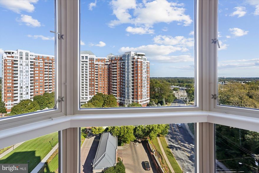 Looking out over the vistas with a 180 degree view is just one of the fantastic qualities of living in this full-service building.  With over 1800 square feet spread out over three bedrooms and three full bathrooms, this unit lives like a single family home all on one level.  Upon entering into the gracious foyer, the property opens before you with sight lines across the vistas with skyline views.  The Kitchen, Living Room, and Dining Room flow easily from one to the other with generous portions in each space.  The Dining Room has a sliding glass door leading out to your private balcony large enough to fit an outdoor table set to watch the weather pass through the region from Virginia, through Washington, DC and out toward the east of Maryland.  This property comes with three deeded parking spaces one of which is conveniently located at the elevator for easy access bringing your things into the unit.  Additionally it comes with a generous storage space and access to The Wisconsin's exclusive amenities: Indoor and Outdoor pools; Club House with Fitness Center including changing and exercise rooms; security at the gated kiosk and 24 hour front desk;  well maintained promenade and courtyard are beautifully planted offering a welcoming and charming entry; modern community rooms and multiple sitting areas.  The close proximity to Metro, Whole Foods, Pike and Rose shops and restaurants keep you near everything you need.  The Wisconsin is a full-service luxury building with a built in community available through the social committee and regular activities keeping residences connected and living a vibrant lifestyle.