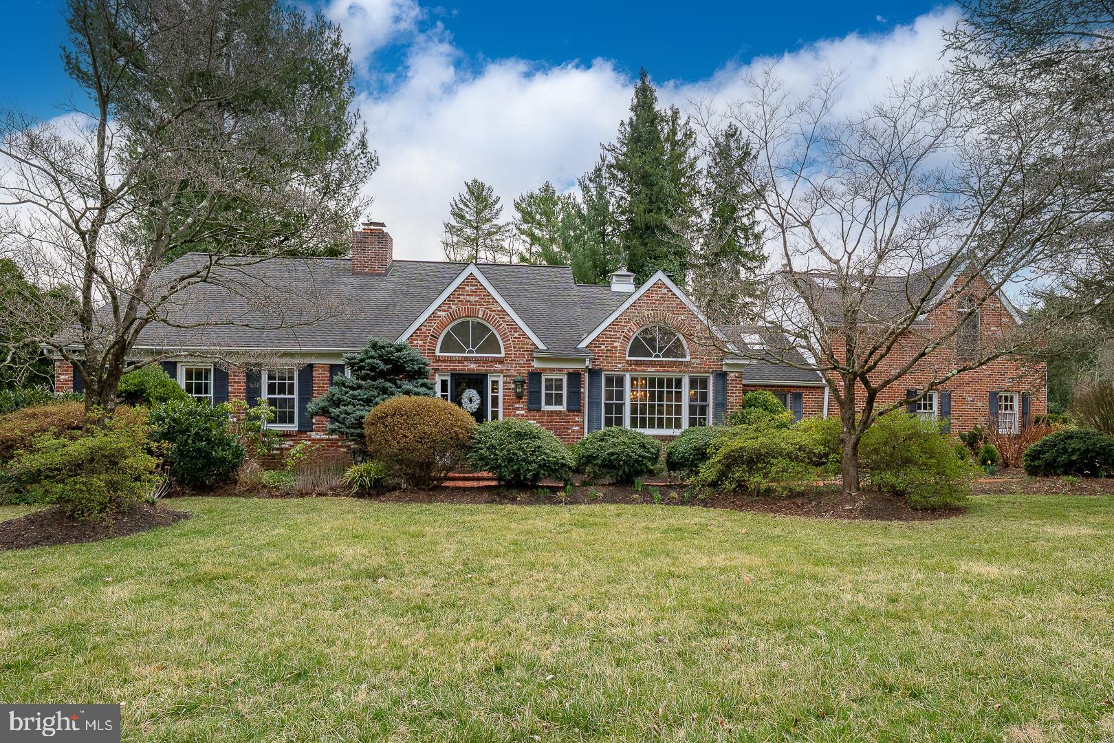 Discover unparalleled luxury and effortless living in this light-filled 5-bedroom, 3 full and 2 half-bath, 2 car garage home with finished basement nestled on a picturesque ¾ acre cul-de-sac lot in a premier Villanova location. Thoughtfully designed for both gracious entertaining and everyday comfort, this home offers a perfect balance of modern luxury, charm, and comfort with breathtaking outdoor spaces, gracious interiors, and thoughtful updates throughout. From the moment you arrive, the pristine grounds set the stage for refined living, featuring a sparkling in-ground swimming pool, tiered poolside decks, lush gardens, and a sprawling lawn—a private oasis just moments from premier conveniences. The main floor features a sun-lit entry foyer leading into a formal living room with a fireplace framed by custom built-in cabinets, and French doors opening to a spacious family room featuring a wet bar with refrigerator and built-in cabinetry, skylights, and a wall of windows and sliders with views and access to park-like backyard, pool area and decks. A formal dining room with a soaring cathedral ceiling and Palladian window sets the stage for memorable gatherings, while the gourmet kitchen boasts a cathedral ceiling, solid surface countertops, tile backsplash, a 6-burner Viking cooktop, Viking convection oven, Sub-Zero refrigerator/freezer, Bosch Dishwasher, pantry and custom cabinetry—all bathed in natural light from the overhead skylights. A private wood-paneled library/home office with a fireplace and custom built-ins provides a refined retreat for work or relaxation. The main floor master suite is a luxurious retreat, featuring two walk-in closets with built ins, a spa-inspired bath (2023) with double sinks, a whirlpool tub, and a steam shower with frameless glass doors. An adjoining room offers flexibility as a private sitting area or additional bedroom. Hardwood floors run throughout the main level, adding warmth and sophistication. Upstairs, spacious bedrooms and versatile spaces await. The second floor features a large cedar closet, a hall bathroom (2021) with jetted tub and two large bedrooms, one with a versatile bonus room presenting unlimited opportunities. Tucked away off the kitchen you’ll find a princess suite addition (2000) with large bedroom, walk in closets, gas fireplace and ensuite bathroom. Downstairs, the finished lower level offers a fantastic retreat for recreation and entertainment, with a game room, media space, and ample storage. Meticulously updated and maintained, this stunning brick home is truly move-in ready. Amenities and updates include three fireplaces, two main floor powder rooms, newer roofs and skylights, three zone HVAC with updated (2023, 2018, 2014) heating and air conditioning units along with many more modern updates. A rare opportunity to own a home of this caliber, where timeless design meets modern luxury. Schedule your tour today and experience the elegance, comfort, and convenience of this exceptional Villanova property