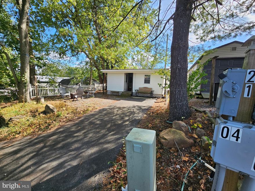 Welcome to Block 21 Lot 4 Old Faceful st (On SEWER) in Riverbends Rv Campground. Riverbend is 400 Acres of SEASONAL recreational campground full of amenities located on the Potomac River in Falling Waters, Wv. OPEN APRIL 1 - NOVEMBER 1 - This is a fun & entertaining community for all ages, yet relaxing. Old Faceful is a tucked away pretty quiet street and on this lot it features a move in ready, beautifully redone camping spot with all new paint, floors, light fixtures and more. This Cabin style features an enclosed deck set up as a living room to relax or host friends and family inside and away from the weather elements. A walk on in, is an additional living room space to be used for whatever your heart desires. Literally everything you see conveys. Off of the living area is a bedroom with a new Queen bed. Stocked Kitchen and ready to be used to make memories! Outside you;ll find a paved drive way and gravel a up and around the cabin for additional parking to the shed or use it as a yard to have a camp fire. Everything in the shed conveys including washer, dryer, and electric golf cart that needs new batteries. Don't wait on this one!


 Call today for your personal tour. Approx. 10 miles of Deep water on the Potomac River access for boating, fishing & swimming. Yearly membership ($1,987) plus a $200 initiation fee for new owners, includes water, Pump outs, electric, trash and the park amenities such as 3 pools, putt putt course, Horseshoe club, Boat club, Poker runs, Trick or Treat, Christmas in July, live bands, basketball court, tennis court, fireworks, car show, Church, restaurant, bar, convenience store (Great food), playground, volleyball, ball field and much much more. Bring your golf carts, water toys and come enjoy life!