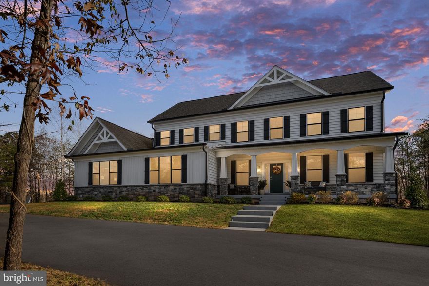 Why wait to build when this gorgeous home is on the market?! Discover refined living at 301 Kingdom Drive in the prestigious Sullivan Reserve of Stafford. This stunning 5-bedroom, 3.5-bath home sits on a corner lot with 3.5 acres and welcomes you with a striking black-and-white exterior accented by stone. Inside, you’ll find 9-foot ceilings on the main, upper, and lower levels, creating an open, airy feel throughout the home. The gorgeous gourmet kitchen features an oversized upgraded window that fills the space with natural light, along with high-end finishes and an expansive island perfect for cooking and gathering.
Hardwood flooring flows through the main level, leading to spacious living and dining areas designed for both everyday comfort and entertaining. The screened porch and adjoining deck offer peaceful views and easy outdoor living. The upper level boasts generous bedrooms, including a luxurious primary suite with a spa-like steam shower. The finished basement continues the home’s bright and open feel with its 9-foot ceilings and offers even more living space, storage, and flexibility.
This property includes a 4-car garage and a whole-home water treatment system, adding convenience and peace of mind. Combining modern elegance with thoughtful upgrades, this exceptional home delivers privacy, functionality, and high-quality craftsmanship in one of Stafford’s most desirable neighborhoods.