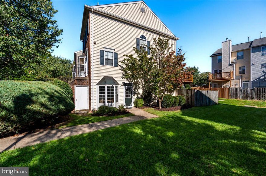 NEW 2024 HVAC! NEW flooring! NEW paint! Beautiful 2 bedroom, 2 bathroom end unit condo on the ground story that flaunts 3 sides of natural light! Your first step into the foyer and dining area with bay window is all about views of sunshine and the grassy side yard. As you move into the kitchen, it is similarly sun-kissed and boasts newer stainless steel appliances, lightened cabinets, new backsplash, and new floors. An LG washer and dryer sit in the closet pantry. As you enter the spacious living room, cozy up to a gas fireplace perfect for this crisp, colorful autumn season. Walk through the fifteen-lite rear door with transom window to a courtyard oasis. The back is fully fenced and recently hardscaped with river rock and a custom brick paver patio. Returning inside, you can retreat to a huge primary bedroom with more than enough space for a king-size bed plus large, additional furniture. And you can smell the construction dust on the en suite, primary bathroom, which recently finished renovation. As if that wasn't enough, 2 assigned parking spaces and an extra storage closet under the brick stairs are immediately next the unit. The amenity-rich condo community includes membership to 2 Crofton Village swimming pools as well as tennis, volleyball, and basketball courts, tot lots, playgrounds, and walking/biking trails. Located within 1 mile of Waugh Chapel Towne Center (Wegmans, Target, Regal Cinema, Bonefish Grill, Outback Steakhouse, Mission BBQ), Walden Country Club, and much much more. Visit before it's gone!