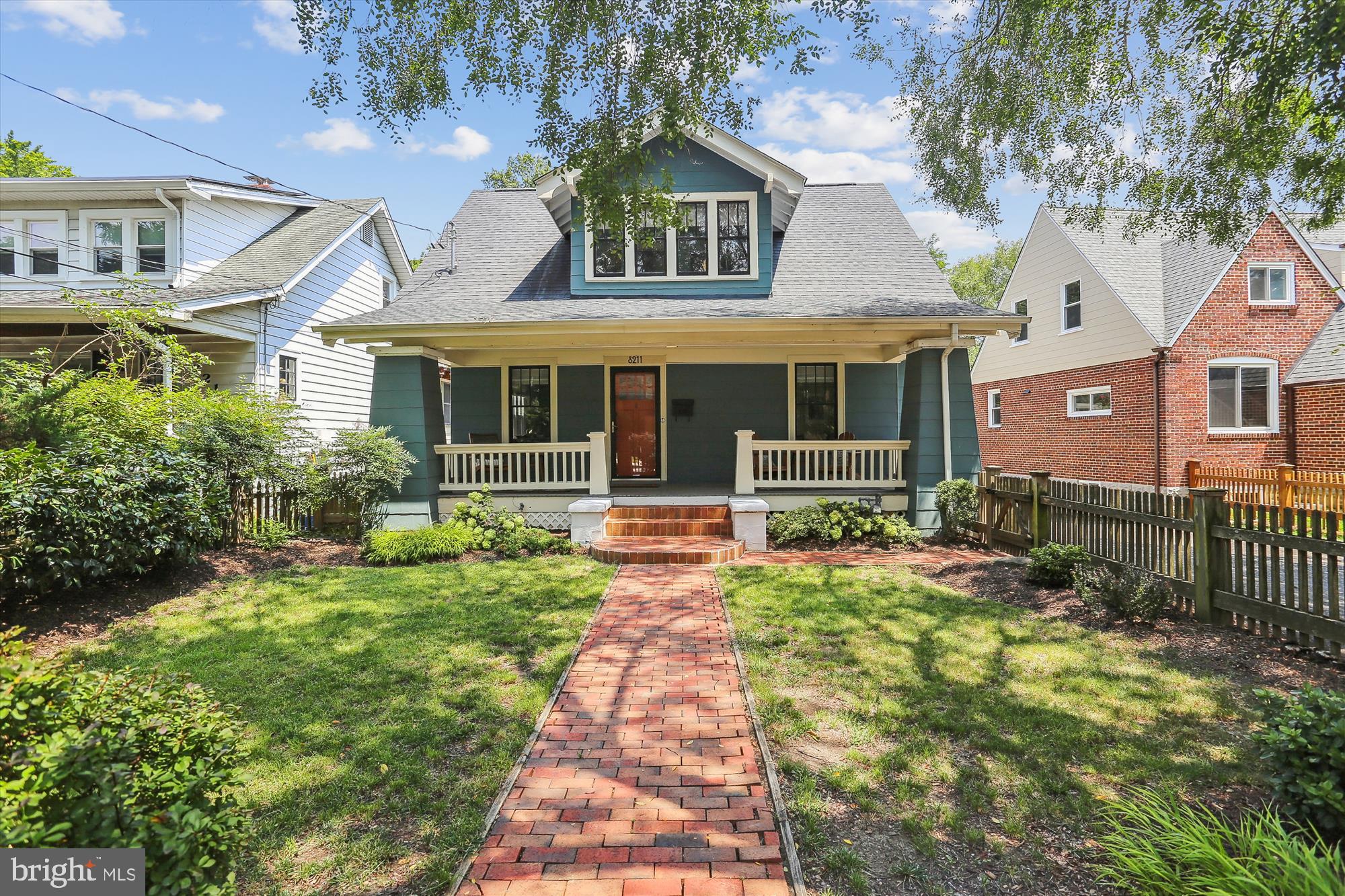 Welcome to 8211 Flower Ave! This charming bungalow style home built in 1937 boasts a classic front porch leading to the front entrance. Step inside the spacious Living Room complete with a wood-burning Fireplace with brick mantel and plenty of natural light. The Living Room opens to a spacious formal Dining Room. The large Kitchen includes a neat breakfast nook under a decorative arch for informal meals. Behind the Kitchen is a rear Mud Room leading to both the rear deck and a separate unfinished storage area, perfect for upgrading into a Powder Room and pantry. The Upper Level includes four Bedrooms with a Full Bathroom. The Lower Level includes a large Rec Room, bonus finished Hobby Room, a second Full Bathroom, laundry room, as well as a second storage room. The Lower Level does have a walk out entrance to the driveway. The flat back yard is complete with a deck and former garage converted into bonus space, perfect either for outdoor storage or a quiet office/studio space. About two miles to either the Takoma Park or Silver Spring Metro stations, plus easy access to 495 and the DC line.