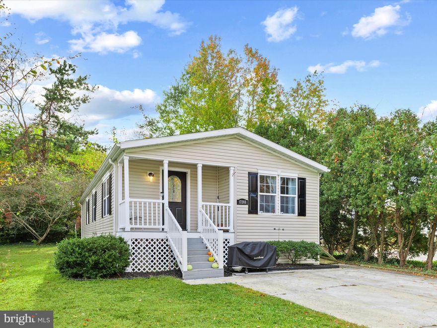 This 3-bedroom, 2-bath doublewide has been beautifully remodeled and freshly painted throughout, offering a bright and inviting layout. A welcoming covered front porch and large yard provide the perfect setting to enjoy the outdoors and relax in the neighborhood. Vaulted ceilings and drywall throughout create a spacious feel, with living space at the front and the bedrooms and bathrooms toward the back for privacy.

The kitchen features stainless steel appliances, maple cabinetry, granite counter tops and a center island, all adjacent to large dining area, and flowing seamlessly into a spacious living room. Vinyl plank flooring runs throughout the home (including the bedrooms), combining style and durability, and the open layout makes this home perfect for both everyday living and entertaining. Thoughtful updates including fresh paint add modern touches throughout.

Sweet Briar is a serene community on the banks of Red Mill Pond in Lewes, just 15 minutes from Lewes Beach. Residents enjoy pond access for kayaking and canoeing, a community pool, a clubhouse with resident-planned activities, full-sized basketball and tennis courts, RV and trailer storage, two playgrounds, dog-walking stations, and beautifully maintained common areas with ponds and fountains. Public water; sewer and trash are included in the monthly land lease. Park application and approval are required for residency.