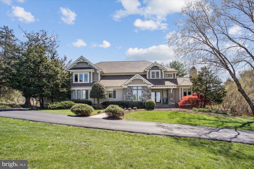 Imagine stunning sunsets from your new dining room, front porch, yard, and bedrooms.  This custom-built craftsman home nestled on a high knoll offers gorgeous sunsets & views of mountains in the distance.
The unique architecture provides a wonderful balance of open living and private spaces, making the 6500+ finished sq ft feel spacious and yet comfortable for everyday living.  The newly renovated gourmet kitchen (2023) is a perfect entertaining spot- marble counters, custom copper farmhouse sink, and an expansive island- no details have been overlooked.  Cooks will love the state-of-the-art Thermador Freedom induction cooktop, Jenn Aire Obsidian cabinet fridge, Cafe wall ovens, Bosch cabinet dishwasher.  The kitchen flows into a large great room where the gas fireplace blower keeps the room warm & cozy.  Steps away, French doors open to the office/library, a second fireplace & built-in bookcases.  Enjoy the convenient main-level guest bedroom with full bath and appreciate the practicality of a mudroom &  shoe closet off the garage, next to the large first-floor laundry room.  
Maple stairs lead to the primary suite, a private retreat with expansive windows, a sitting nook, 2 walk-in closets, and an updated spa-like bath.  Down the hall, you'll find 3 additional generous-sized bedrooms and 2 updated full baths.
Head to the light-filled walk-out basement and discover an amazing entertainment space- movie room, wet bar with fridge & icemaker. Skip the gym and enjoy the workout room with padded floors & a wall of mirrors. Sliding glass doors lead to a peaceful flagstone patio, a perfect spot for morning coffee.  Your guests, family, or nanny will love the large bedroom with a walk-in closet and a full bath. There is also a powder room and plenty of storage on this lower level.
The three-door garage fits 3 SUVs with space to open all the doors! Built-in cabinetry, a sink, and work area finish this space.  New remote-capable openers make deliveries a breeze.  
Mature Holly and Cyprus trees frame the house, and the 1.74-acre flat usable lot is large enough for soccer practice or a private pool.  An electric fence keeps your furry friends close to home, while new landscape lighting highlights the home's gorgeous exterior features at night.  
****The house has public water, sewer, and gas!- a rare treat in Great Falls!
Located in Fairfax County, the home is assigned to sought-after Great Falls Elementary, Cooper Middle, and Langley High Schools. Residents of Lowes Island Estates have access to all the Cascades amenities (5 pools, tennis and pickleball courts, fitness center—a pool, playground, & tennis court are located just steps away from the house). Golf lovers— enjoy exclusive golf cart access to an award-winning course or a quick drive to several other courses. Like vacationing at home? Seneca Regional Park stretches out just behind the house with miles of walking trails and a short path to the Potomac River. 
With easy access to points both east and west, you can enjoy Reston Town Center restaurants, shopping & metro, shopping at Tyson's Corner &  Leesburg Outlets. Spend Saturday enjoying a local winery or catching a show at nearby Wolf Trap Performing Arts Center.  
Great Falls is a wonderful community offering annual art tours, musicians, family-friendly movies & holiday celebrations on the Green in Great Falls Village, access to miles of parks and hiking trails along the Potomac and Great Falls Park. 
This is the opportunity & lifestyle you have been waiting for. The home has been lovingly updated.  A full list is in the documents- some include:  (2025) maple stairs/floors, carpet, water heater, fireplace blower; (2024) landscape lighting, powder room, primary bath update; (2023) kitchen appliances/counters & cabinet update; (2022) furnace both zones/humidifier & insulation; (2021-2023)updated baths; (2019)architectural roof, windows, pergola, Hardiplank, Azek trim.
Listing agent is the homeowner.