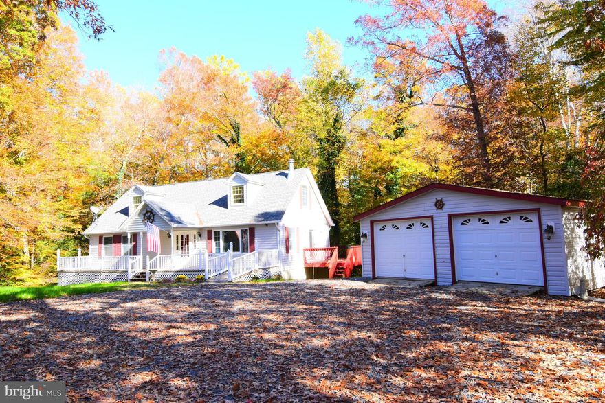 Nice Cape Cod on private 1 acre lot. Detached 2 car garage. Hardwood laminate in family room with fireplace. Brand new carpet and paint thru out. 2 bedrooms on the main level and 2 large bedrooms upstairs. 3 full baths. Large deck with hot tub to sit back relax and watch all the birds! No HOA.