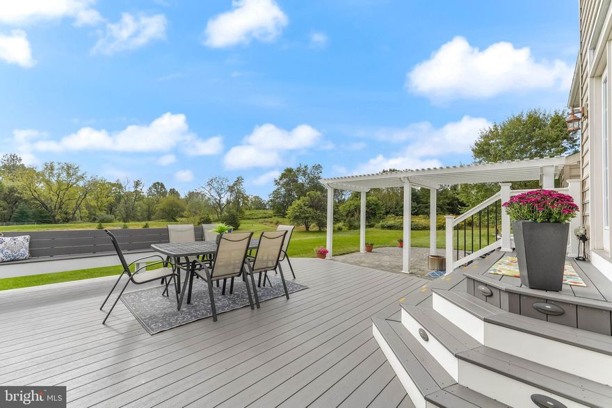 Calling all nature lovers!  This Executive home has the most amazing back yard space complete with a maintenance free deck, a paver patio with a lovely pergola and an amazing hot tub from which to enjoy VIEWS of the OPEN MEADOWS behind the home and all the birds and wildlife that enjoy the open space.  You will appreciate the prime, Chadds Ford location in the AWARD-WINNING Kennett Consolidated school district, near Wilmington, West Chester, and Philadelphia just a short drive to Longwood Gardens. From the moment you pull into the neighborhood, you will take note of the generously sized lots and the magnificent semi custom-built homes. Once you enter the home, you will appreciate the hardwood floors, the center entry hall and the beautiful dining and formal living rooms that flank the main entrance. To the rear of the home, you will find a spacious office with lots of built ins and storage that faces the magnificent views of the meadows and open space behind the home.   The two story, OPEN CONCEPT family room has a gorgeous window wall and center fireplace that also focus on the beautiful open space and backyard.  Adjacent to the family room is a generously sized kitchen with a center island, granite counter tops, a beautiful travertine backsplash and stainless-steel appliances.  There is a raised breakfast bar between the kitchen and the breakfast room which leaves plenty of space for a full-sized table and bar seating to host that informal event.  The breakfast room has two window walls and opens to the lovely deck and patio area just outside.  The upper level has a very generously sized primary suite with a beautiful tray ceiling and a sitting area that opens to a private outside balcony that overlooks the lovely open space behind the home, the perfect place to enjoy that cup of coffee or to read a book as the sun sets.  The en-suite primary bathroom has a large built-in tub, two vanities, a toilet room and a custom shower.  A lovely balcony separates the master from the other three bedrooms one of which has its own en-suite bathroom and there is an additional full bathroom at the end of the hall. The basement has a full set of stairs for the walkout and features a poured concrete foundation and very high ceilings, ready to be finished should you desire additional living space. Great location, gorgeous lot, lovely hardwood floors, maintenance free deck, beautiful paver patio, welcoming hot tub and pergola area, and the most amazing backyard and meadow views make this move-in-ready, spectacular home one that you will want to call your own. Stucco is located only on the front of the house; it was inspected in 2021 by the sellers and there were no areas of elevated moisture found.  Report is loaded into the MLS for your review.  Be sure to put this well maintained, executive home on your tour today. You will surely want to call it home.