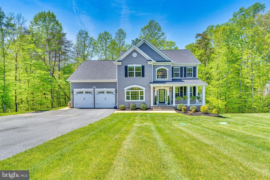 Welcome to 2411 Comptrollers Ct, a like-new, 4-year-old home in the highly desirable Oakland Hall community of Prince Frederick, MD, that is steps away from the Community Pool & Clubhouse.  Impeccably maintained, this spacious home offers three finished levels and is loaded with builder upgrades, including extensive crown moldings, gleaming hardwood floors throughout the main level, and a stunning two-story entry with a beautiful staircase. The open-concept kitchen and family room. Features a cozy gas fireplace. The kitchen has a large island, two pantries, and seamless access to a maintenance-free wrap-around deck overlooking a serene, wooded backdrop. With 5 generously sized bedrooms and 3.5 baths, the home is ideal for families or anyone seeking space and comfort. The luxurious primary suite includes custom closets, a tray ceiling, and a spa-like bath with a pedestal soaking tub, oversized shower, and dual vanities. The finished lower level offers a large recreation room, a bedroom with a full bath, and an expansive storage/utility area. Additional features include a whole-house water softener and chlorination system, plus an underground lawn irrigation system to keep your yard lush. Just steps away, the community pool and clubhouse are hubs for summer fun, while year-round events like the Fourth of July parade, Halloween festivities, Turkey Bowl, and cornhole tournaments foster a true sense of community. Conveniently located near Joint Base Andrews, PAX River, DC, and Annapolis—and in one of Maryland’s top-rated school districts—this is more than a house; it’s the lifestyle you’ve been dreaming of. Make 2411 Comptrollers Ct your new home and start creating lasting memories. EV and RV charging available.