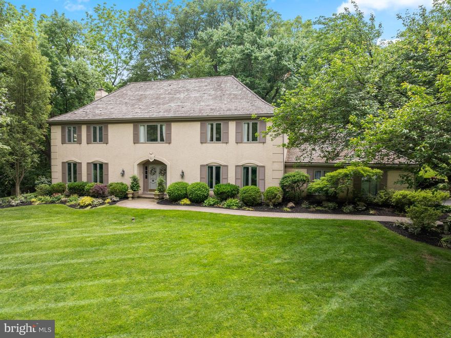 OPEN HOUSE CANCELLED. Welcome to 130 Hunt Valley Circle in the bucolic, sought-after neighborhood of Newtown Hunt in Berwyn. This gracious center hall colonial features 4 bedrooms, 2 full and 2 half bathrooms and a finished lower level nestled on a picturesque 1.38 acre lot with public sewer and a GENERATOR and new A/C in June 2025.. As you walk up the pavered walkway and enter through the double doors, you are greeted by a welcoming foyer, with parquet wood flooring and flanked by the living room and formal dining room. To the left is the inviting living room with ample windows to take in the natural beauty outside. The formal dining room is a perfect setting for hosting dinner parties and boasts chair rail and crown moldings. The eat-in kitchen features hardwood floors, white cabinets, stainless steel appliances, built-in desk, and a peninsula with granite countertops. The breakfast room boasts built-ins to house your dishes and cookbooks and has a sliding door to access the lovely covered porch, a great outdoor living space! The charming family room has a beautiful stone gas fireplace with built-ins and a slider to the covered porch for summer entertaining. A 2 car attached garage, a mudroom with washer & dryer and a convenient second powder room complete this floor. On the second level, the expansive primary suite serves as a personal sanctuary, complete with a huge bedroom, a sitting area, walk-in closet, and private office. Indulge in the luxurious primary bathroom, featuring a jetted tub, stall shower, bidet, and double vanity. There are three additional generously sized bedrooms and a hall bathroom with a new vanity and tub/shower combo. The finished lower level is perfect for hosting fun gatherings, like watching football or game night, featuring a large recreation room with a walk-up wet bar and mini beverage fridge. Adjacent to this, a cozy man cave awaits, featuring dedicated wine storage and a wine refrigerator, making it the perfect retreat for relaxation. This lovely, well maintained home offers a unique blend of privacy and community in a private park-like setting & great convenient location! Close to the prestigious Episcopal Academy and award winning Marple Newtown Schools.