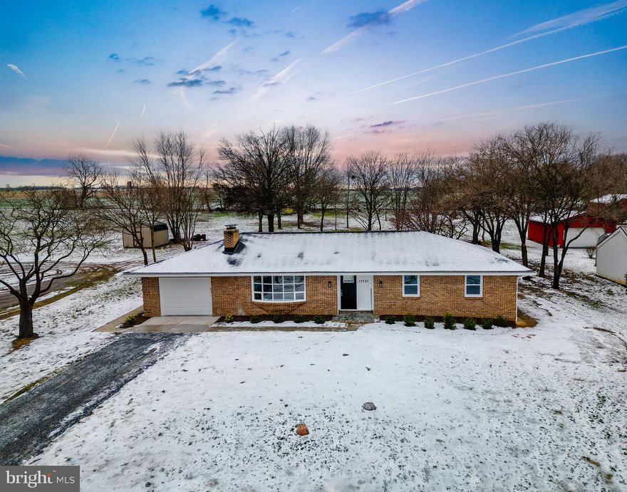 ​Welcome to this beautifully renovated 4-bedroom, 3 full bath Rancher, offering spacious one-level living with a fully finished basement and bonus room. The home features an attached one-car garage and convenient laundry hookups on both the main and lower levels. The lower level is also roughed in for a second full kitchen, providing excellent potential for an in-law suite or extended living space.
Renovations include all-new plumbing, roof, and HVAC for peace of mind. The main kitchen boasts stainless steel appliances, a bar counter with additional workspace, and abundant storage. Outside, enjoy a large open yard that backs to peaceful farmland and offers scenic views of Whitetail Ski Resort from the front yard. Ideally located near I-81, close to Hagerstown’s amenities, and just minutes from the Hagerstown Regional Airport, this home combines comfort, convenience, and rural charm.