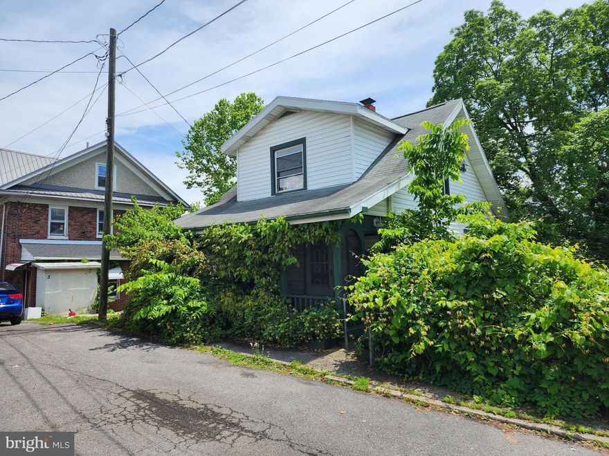 INVESTOR ALERT !!! PERCHED ON A HILL OVERLOOKING CUMBERLAND MARYLAND AND THE POTOMAC RIVER SITS THIS HOME IN NEED OF SOME TLC.  WITH A LITTLE IMAGINATION AND INGENUITY ONE COULD EASILY RESTORE THIS PROPERTY TO IT'S FORMER GLORY.  POTENTIAL  EXTERIOR IMPROVEMENTS  COULD INCLUDE CLEARING BRUSH AND TREES TO OPEN A VIEW OF THE RIVER AND CREATING OFF-STREET PARKING BESIDE THE HOUSE.  LOCATED WITHIN WALKING DISTANCE OF DOWN-TOWN CUMBERLAND AND THE C&O CANAL TOWPATH. GRAB YOUR SAW AND HAMMER,  DEVELOP A LITTLE SWEAT,  AND CREATE A MORE DESIRABLE PROPERTY IN NO-TIME.  CHECK IT OUT TODAY!