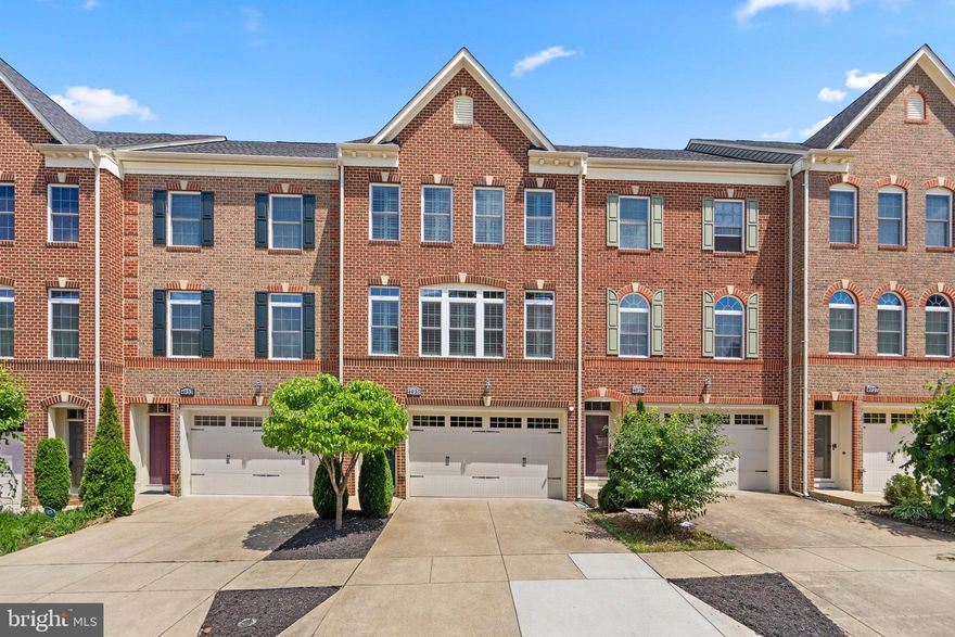 This charming brick interior row townhome at 4931 Collingtons Bounty Dr in Bowie offers three bedrooms and 3.5 baths, providing ample space and modern conveniences. On the main floor, you'll find a living room, family room, kitchen, dining room, and powder room, all featuring beautiful hardwood floors and updated light fixtures. The kitchen boasts a new built-in microwave, under-cabinet lighting, and plantation shutters.
Upstairs, the three bedrooms each have ceiling fans, with the primary bedroom featuring ceiling speakers, a frameless shower door in the bath, and updated mirrors.
The lower level is perfect for entertainment, with LPV flooring, ceiling speakers, a bar with a mini fridge, and a newly restored patio. Additional features include a new water heater, security system with cameras, and TV wall mounts with electrical outlets.
Outdoors, enjoy the privacy of a fenced yard with a gate, a 10x18 composite deck, and a freshly painted garage floor with a storage rack on the ceiling.
This home is part of a vibrant community with convenient access to two metro stations, and it's just 14 minutes from Washington DC. Nearby amenities include a grocery store, restaurants, shops, a gym, playground, and walking and bike trails, making it an ideal location for modern living.