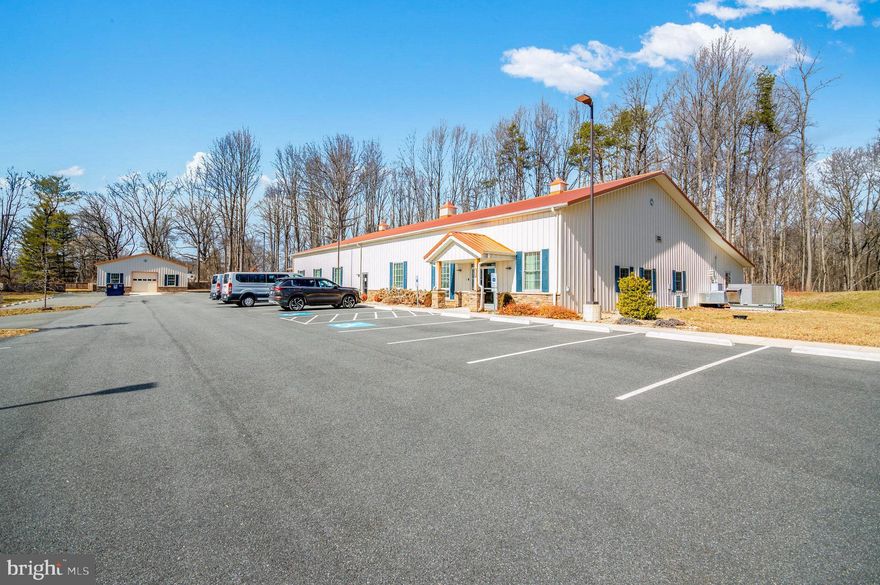 This is a unique opportunity to own an exceptional property in a prime location and much sought-after Exceptional Commercial Property in the Highly Sought-After Opal Service District. Prime Investment Opportunity with Expansion Potential | 8.31 Acres | Two Quality Morton Buildings.
This is a rare opportunity to own a premium commercial property in one of the most strategic and rapidly developing locations—the Opal Service District, known for its high visibility and accessibility. With 8.31 acres, this property is thoughtfully developed and offers incredible potential for expansion.
Main Building (Constructed in 2021) – 9,310 sq. ft.
* 12 private offices
* Large reception area
* Two mechanical rooms
* U-shaped kitchen
* (2) Restrooms with showers
* Laundry & storage room
* 250-person conference/training room with future expansion in mind
* High-quality Morton construction

Second Building – 1,908 sq. ft.
* Large open garage/workshop with roll-up door
* 3+ private offices
* Separate HVAC system
* Currently used for training purposes

Outdoor & Site Features
* Parking: 46 paved spaces, including 2 handicap-accessible and an EV charging station
* Covered side patio with built-in benches and grill
* (2) Fenced picnic areas
* Cleared land ready for outdoor training (special-use permit in place)
* Wooded perimeter provides natural privacy

Infrastructure & Utilities
* (2) Wells & (2) Septic Systems
* Backup Generator
* Zoned C-2 – suitable for a wide range of commercial uses
* Approved to expand up to an additional 8,700 sq. ft. of building space

Location Advantages
* Just 500 feet from the Rt 15/29 & Opal Road intersection (signalized light)
* Over 89,000 vehicles per day (VPD)
* Less than 15 minutes to downtown Warrenton, 20 minutes to Culpeper, approximately 50 minutes to Washington Dulles International Airport
* Surrounded by new residential developments, retail, and service businesses, 3 Gas stations within a 1-mile radius (Sheetz, Royal Farms, Shell)

Ideal For:  Corporate HQ • Training Centers • Medical or Wellness Clinics • Tech or R&D Facilities • Event and Training Spaces • Mixed-use Development • Religious Centers

Whether you're expanding your business, establishing a regional headquarters, or investing in one of Northern Virginia's fastest-growing areas, this property delivers unmatched potential, space, and location.