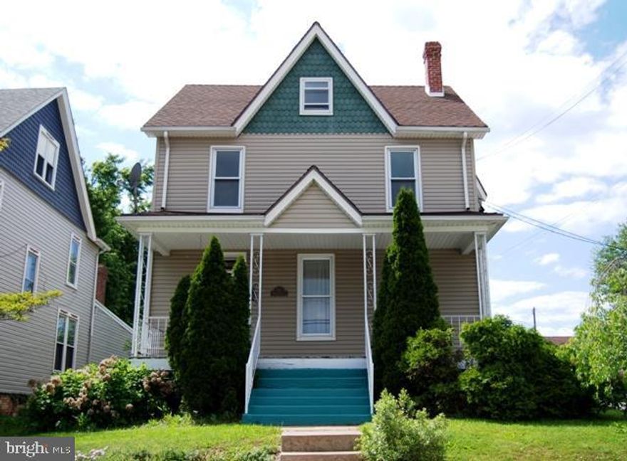 Looking for Victorian charm? Town convenience, current updates add to the livability of this home. Original inlaid wood floors, functioning pocket doors, smoke house now garden shed all remain, while new windows, vinyl siding, newer carpet, central air in BR's, updated kitchen & wiring make it move in ready. Detached garage, fenced yard. Walk to rail/trail, town!