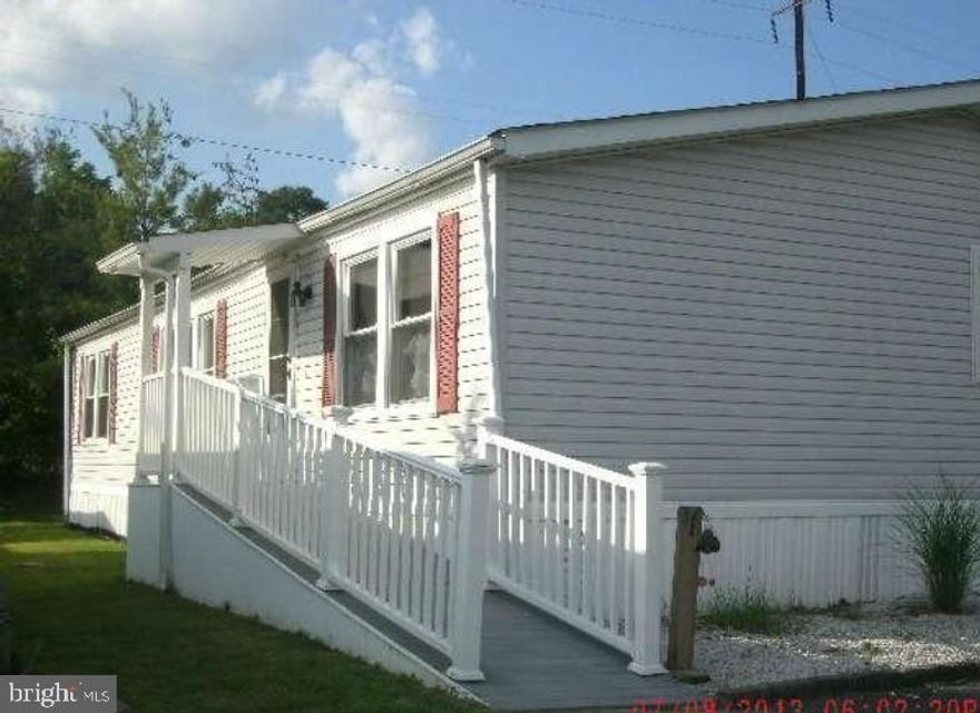 Remodeled 4 bedrooms 2 bathrooms 1400 sq ft doublewide mobile home,  with ramp & covered porch, deck,  twin parking pad, in the back of a quiet private Middle River community.  Water-oriented private community with lot rent. Walking distance to most everything, including Walmart and a Marina and some of Baltimore County's best MA n PA eats!  Near beach, nature center, parks and more.  Generally lot plus financing are around what most buyers currently pay for just rent, sometimes less!  Some Financing Available.   Lot includes lot, property tax, water and sewer hook up,  community management and maintenance, playgrounds,  dog park and walking trail,  gazebo and pavilion,  clubhouse with activities events and dinners etc and residents can use the clubhouse for private occassions $1003 monthly