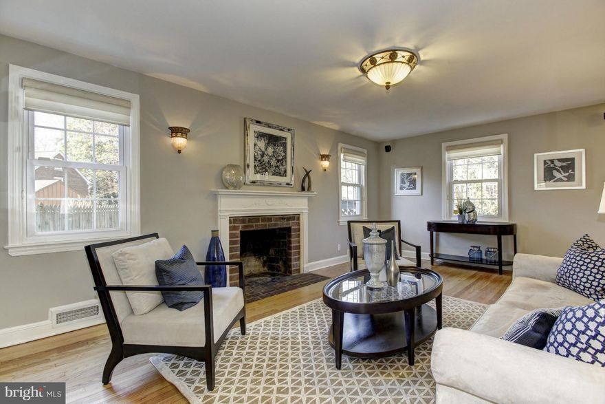 Elegant, sunny 5BR/3.5BA Brick Colonial in Battery Park. Main level includes LR w/wood-burning FP, formal DR & open-plan kit. Kitchen has recently undergone gorgeous renovation, attached family room, HB & vaulted ceilings. Upper 2 levels have 5BR/3BA and all baths have been recently updated. LL is laundry & utility rooms w/plentiful storage. Rear of home opens to patio & backyard.one-car garage.